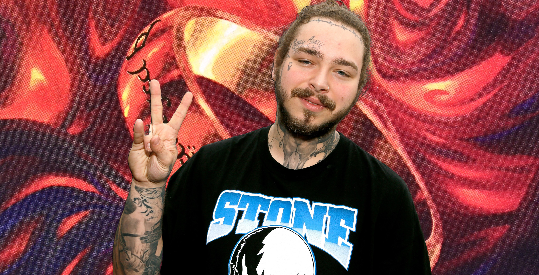 Post Malone looks happy and makes a peace sign, superimposed on a detail of the illustration of the One Ring card, showing a golden ring