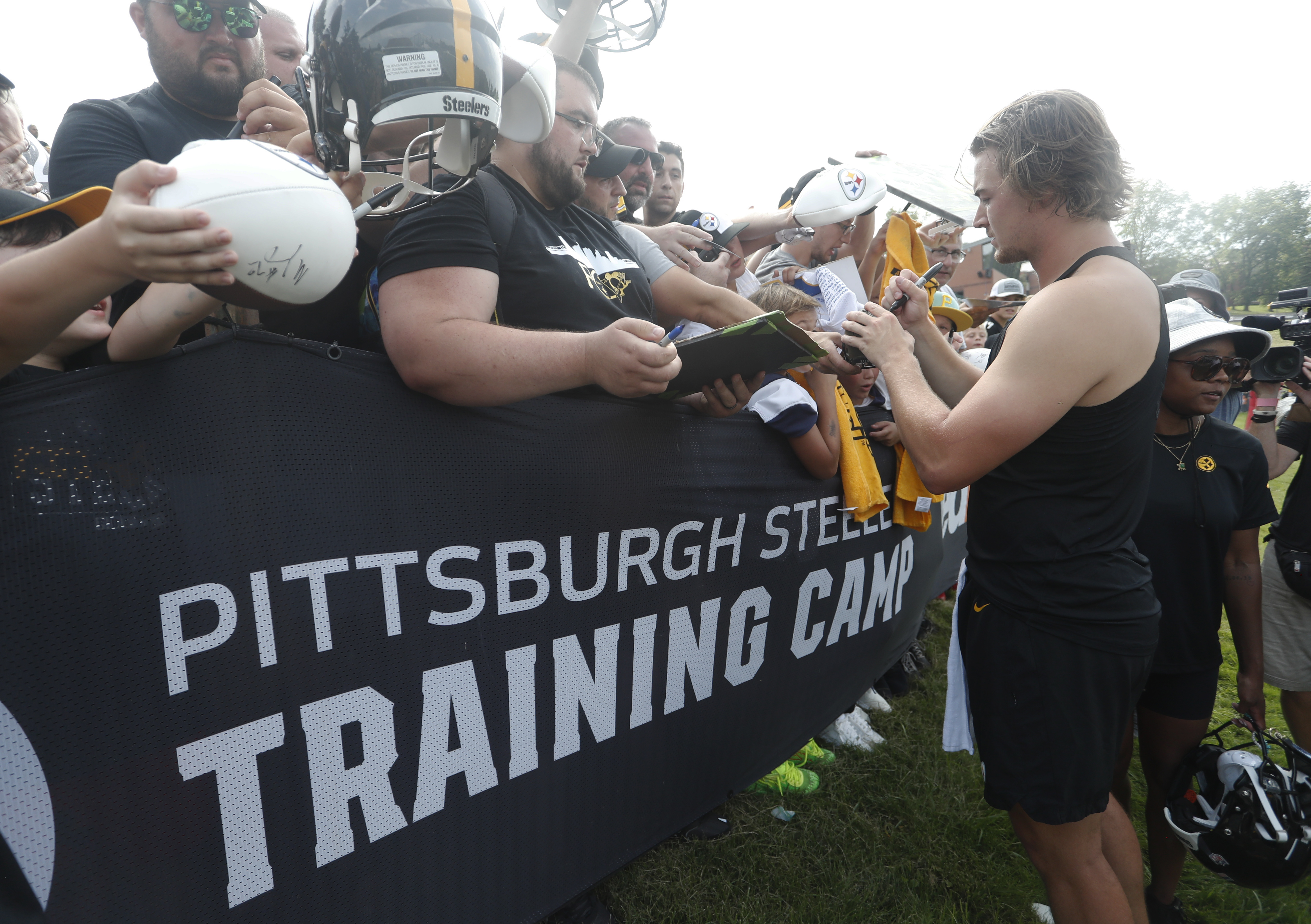 Steelers quarterback Kenny Pickett (8) signs autographs during training camp at Saint Vincent College. Mandatory Credit: Charles LeClaire