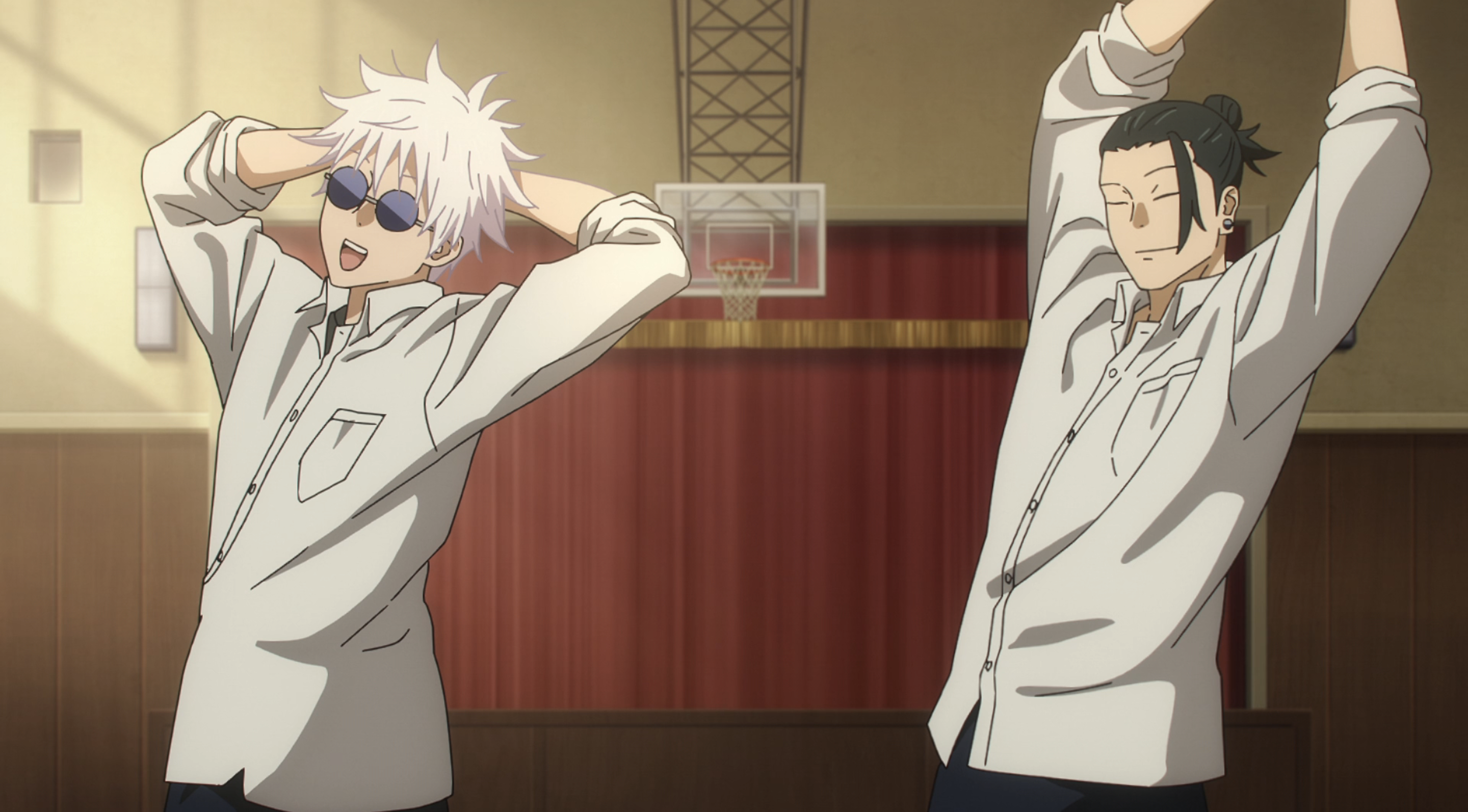 An image of Saturo Gojo and Suguru Geto standing in a school gym in Jujutsu Kaisen season 2. The two look relaxed and happy hanging out with eachother. 