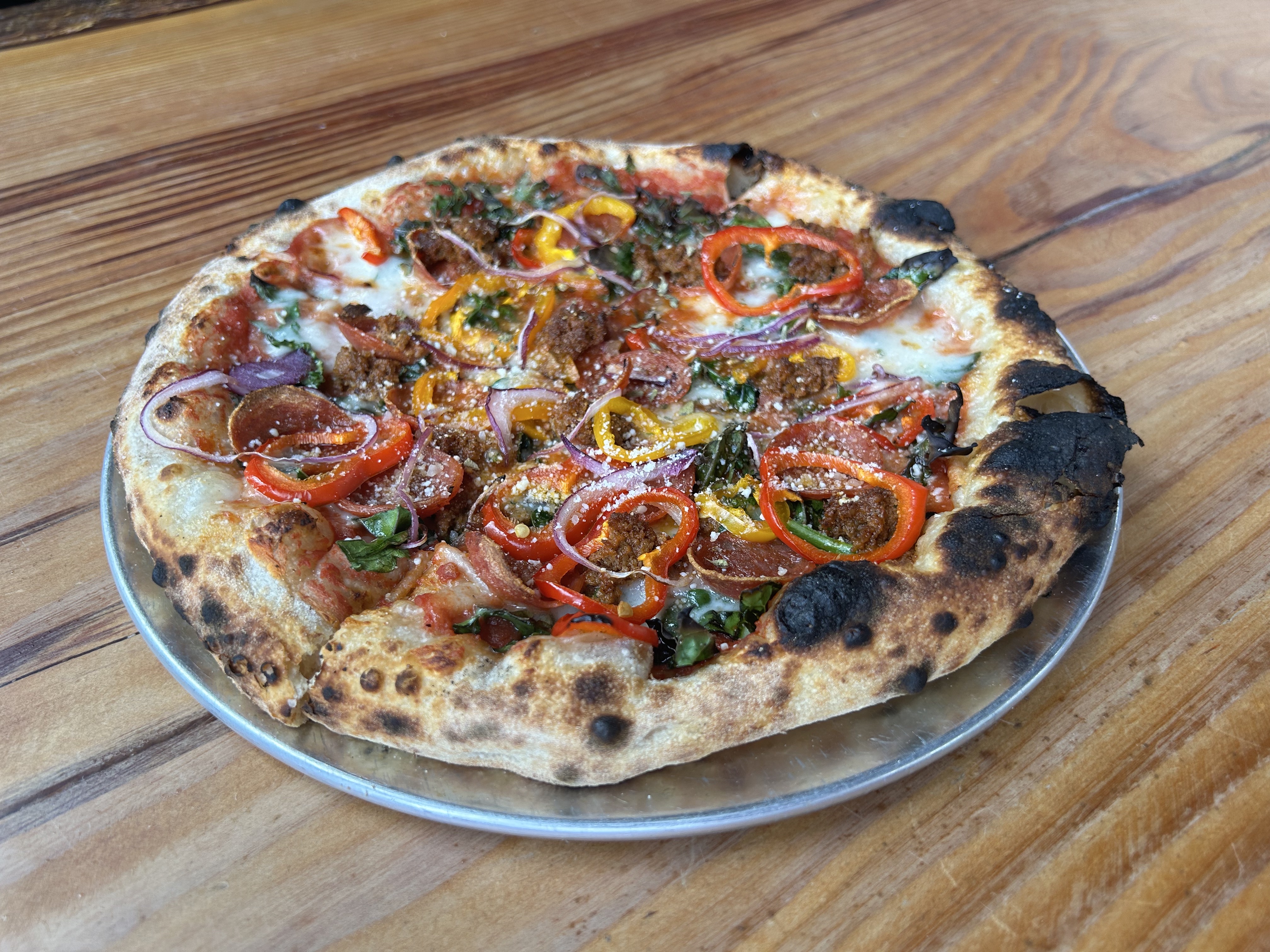 A pizza with house-made cheese, pepperoni, and house-made chorizo at Living Haus in Portland, Oregon.
