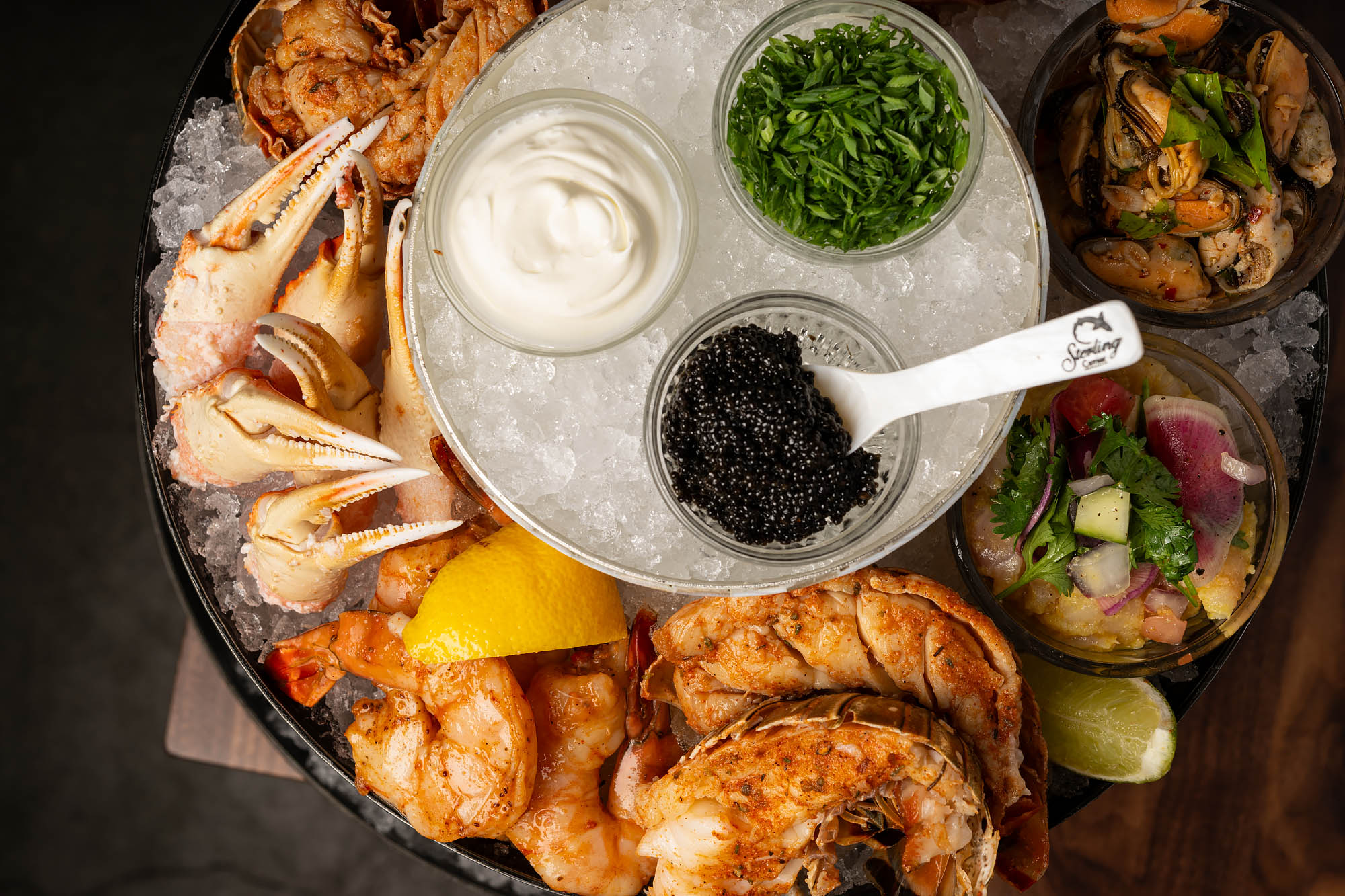 A top-down look at an icey platter of seafood and shellfish, with caviar, from a new restaurant named Joyce in Los Angeles.