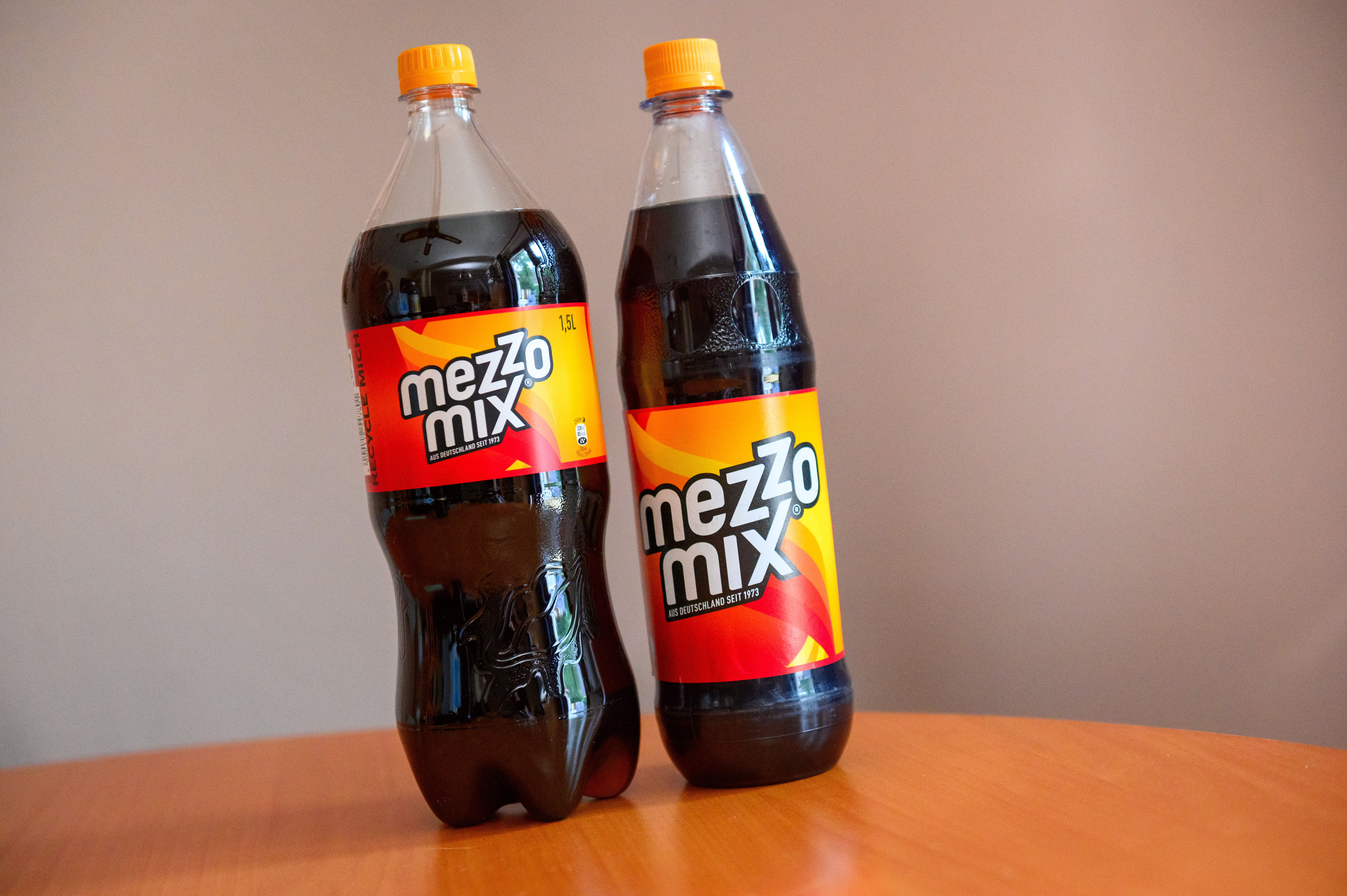 Two bottles of Mezzo Mix sit on a table