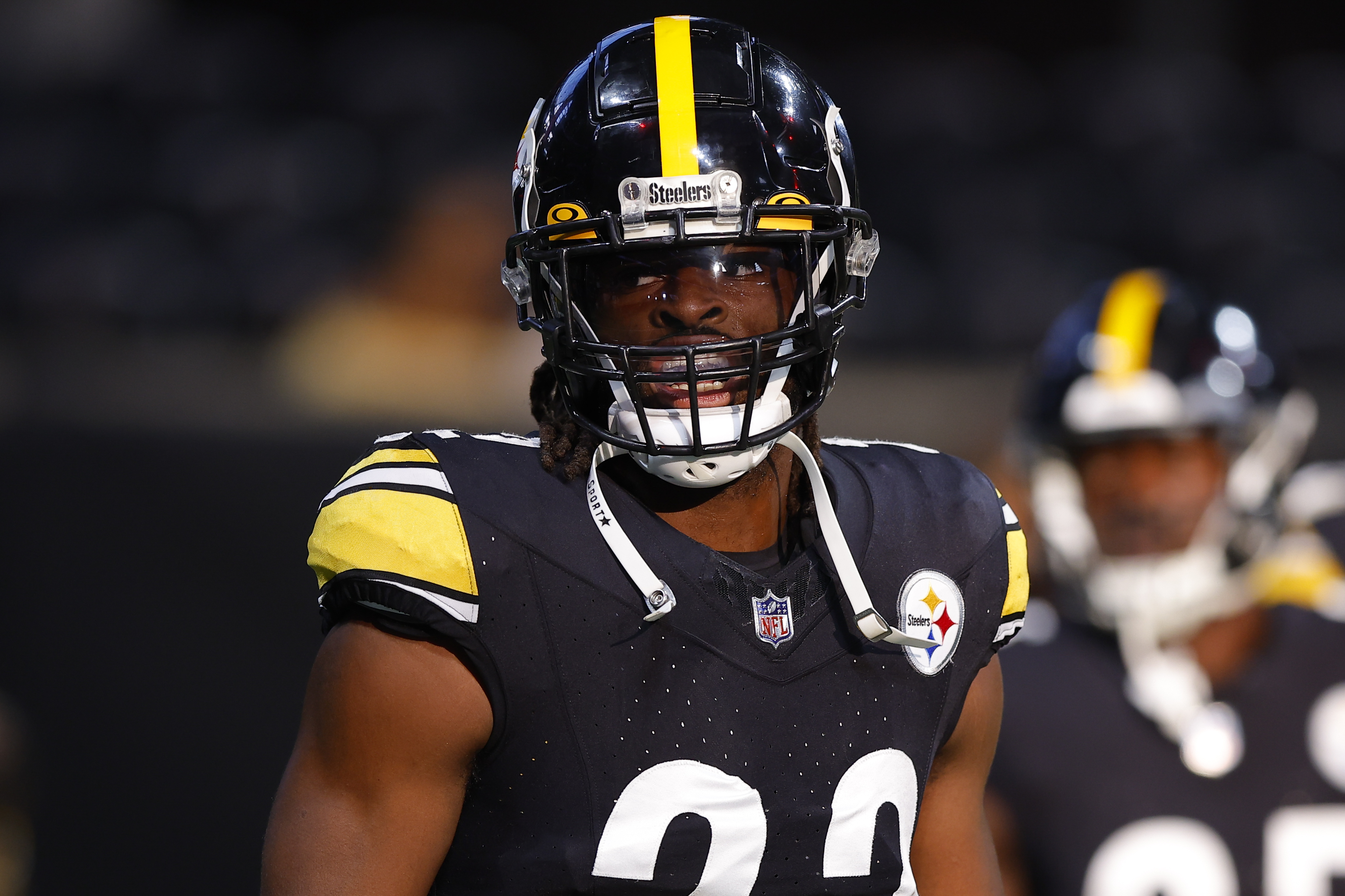 Najee Harris #22 of the Pittsburgh Steelers warms up prior to a preseason game against the Atlanta Falcons at Mercedes-Benz Stadium on August 24, 2023 in Atlanta, Georgia.