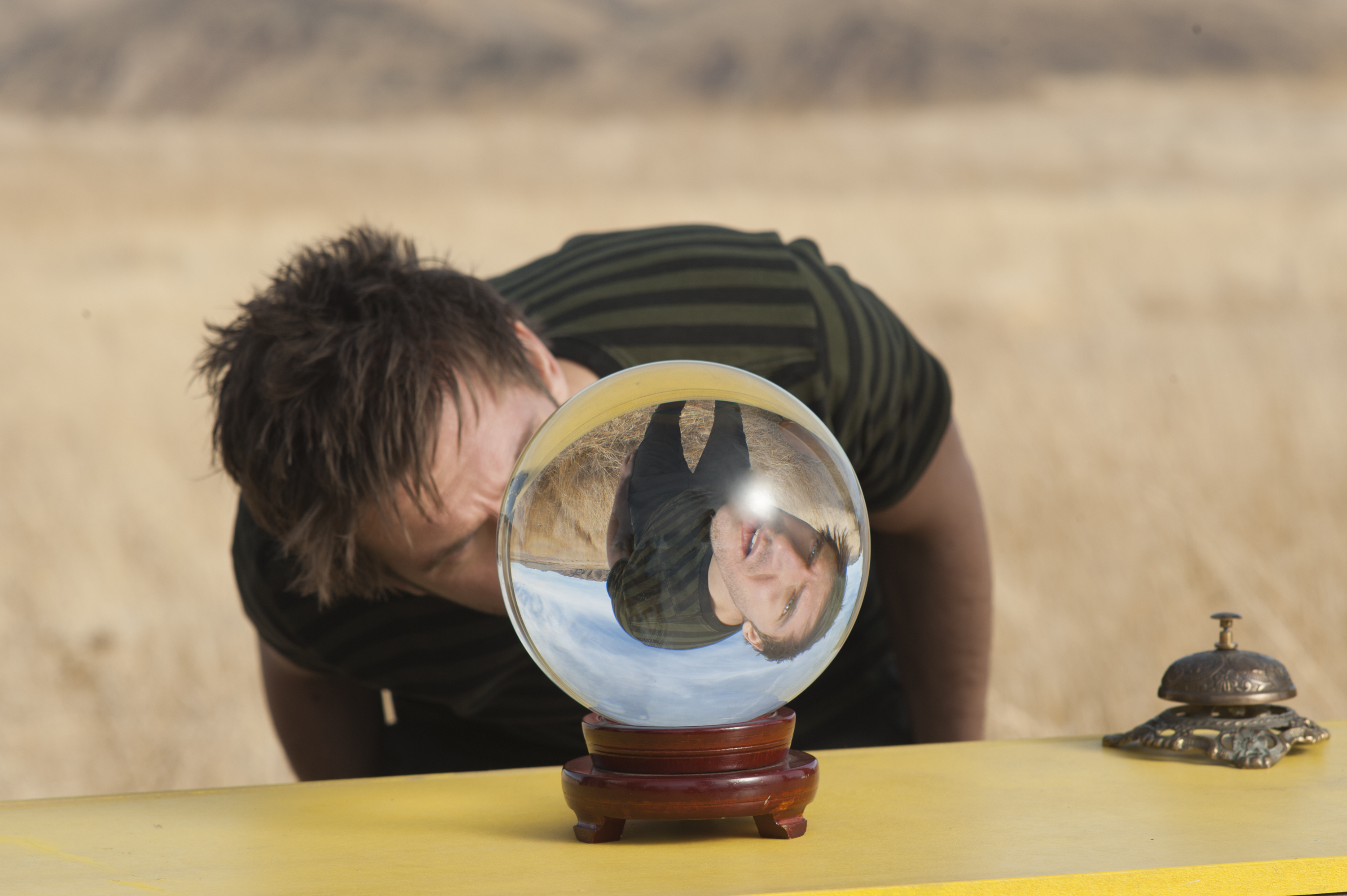 Dan Stevens peers into a crystal ball, as another Dan Stevens peers back at another angle, in Legion.