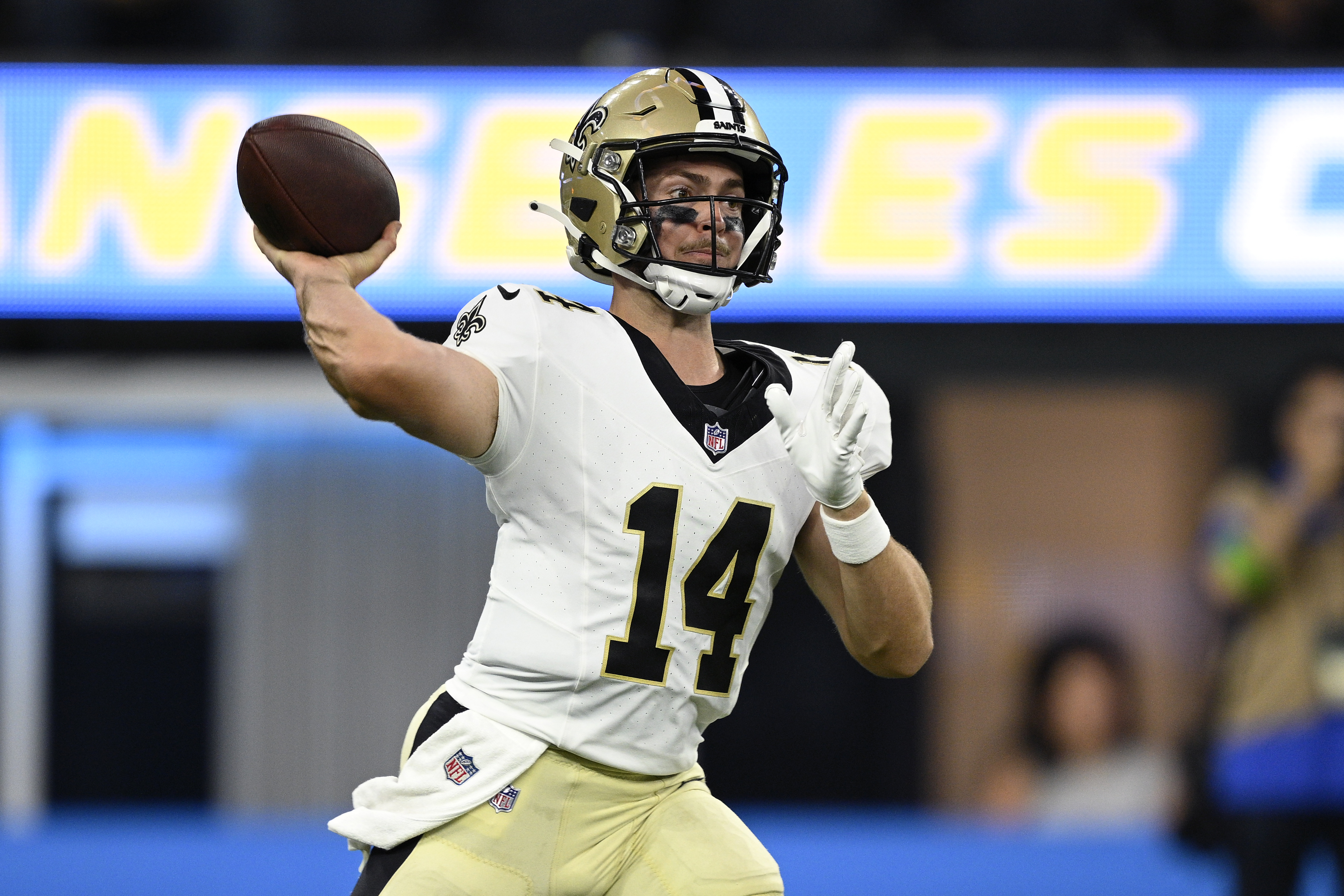 New Orleans Saints quarterback Jake Haener (14) throws a pass against the Los Angeles Chargers during the second half at SoFi Stadium.