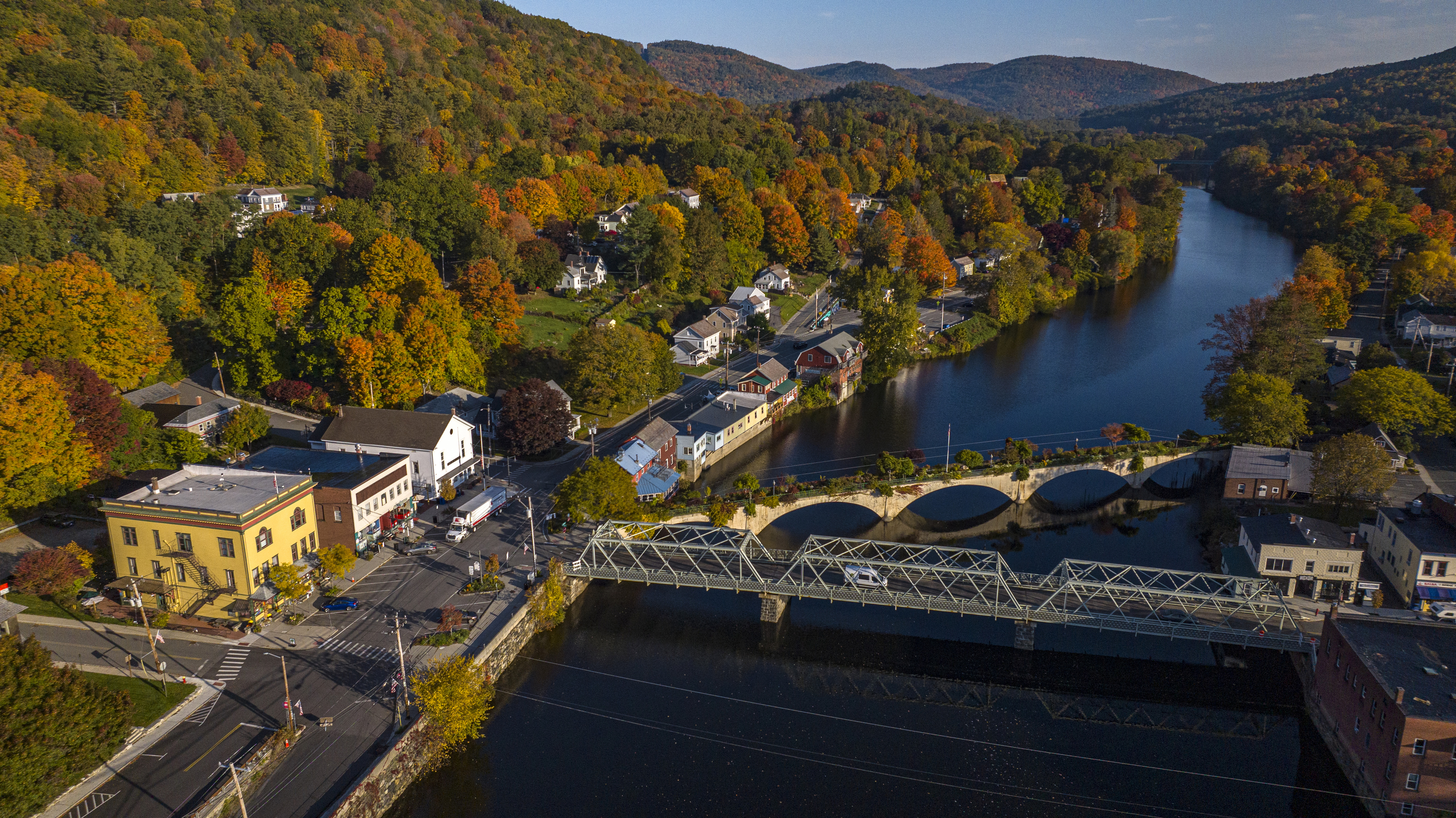 Aerial view at sunrise of Sheffield Falls in autumn, Ma. with Housatonic River running through town, Berkshire Mountains