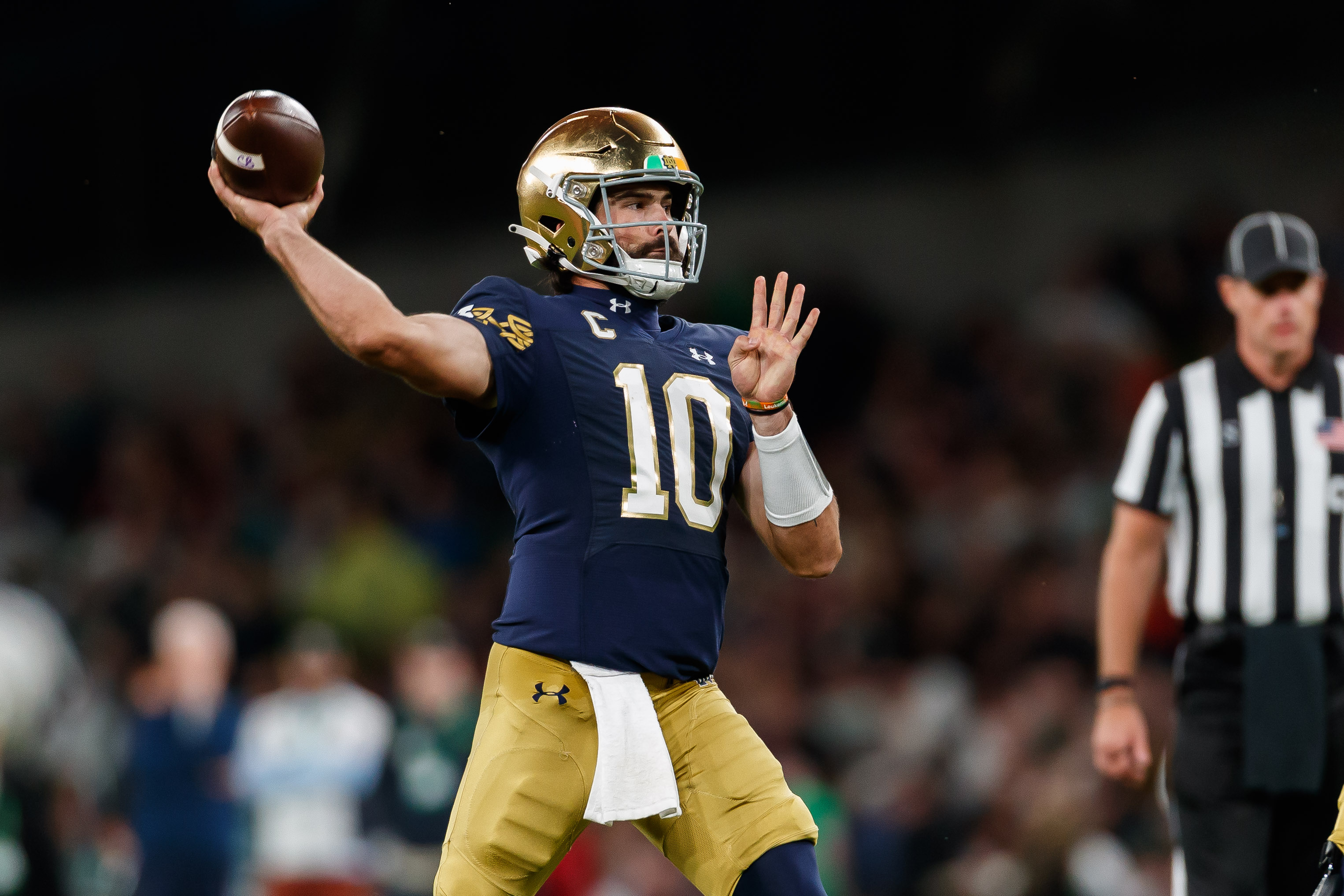 Sam Hartman of Notre Dame controls the ball during the Aer Lingus College Football Classic match between Notre Dame and Navy Midshipmen at Aviva Stadium on August 26, 2023 in Dublin, Ireland.