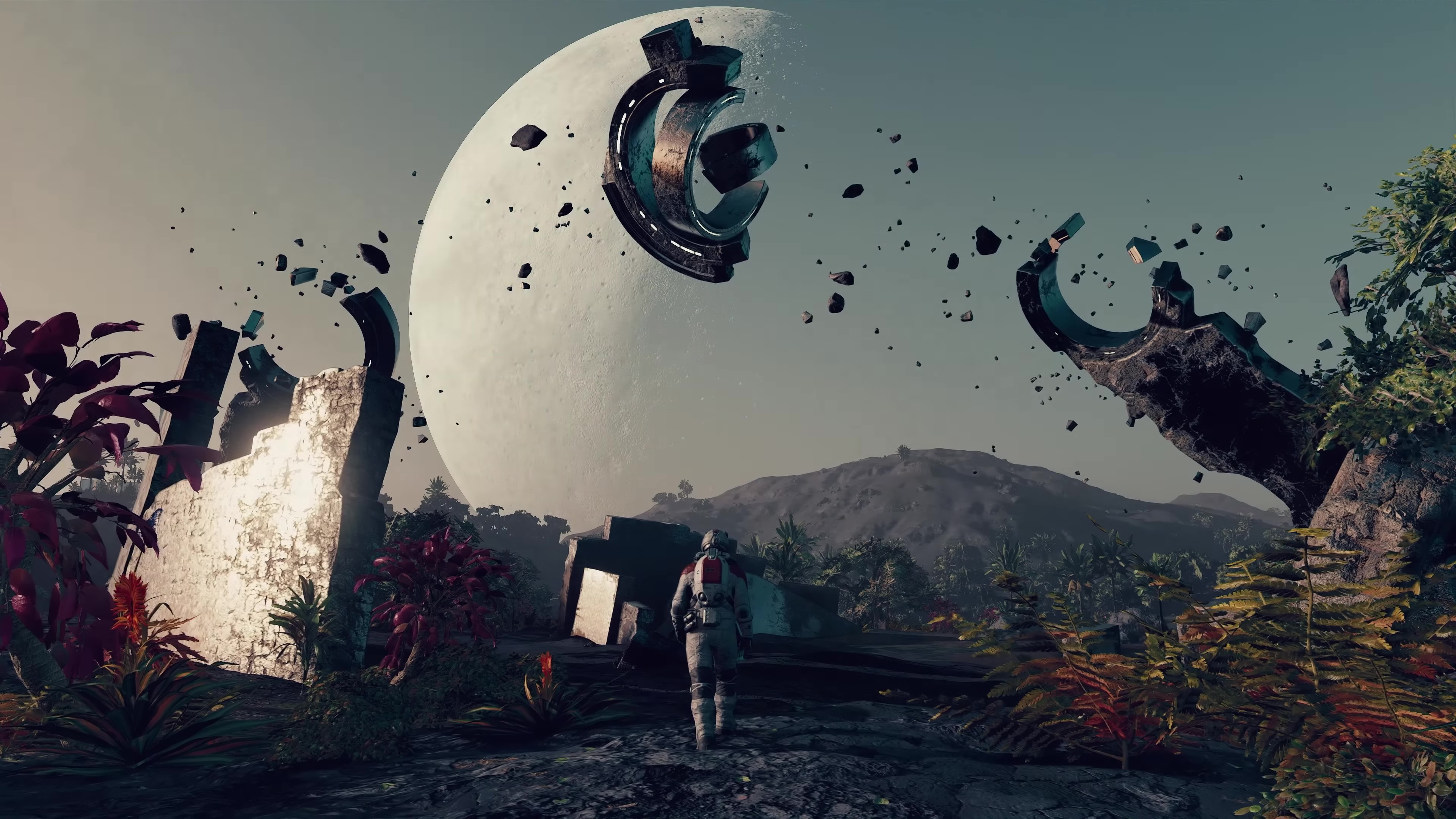 in a screenshot from Starfield, an astronaut walks beneath floating pieces of debris on a rocky planet
