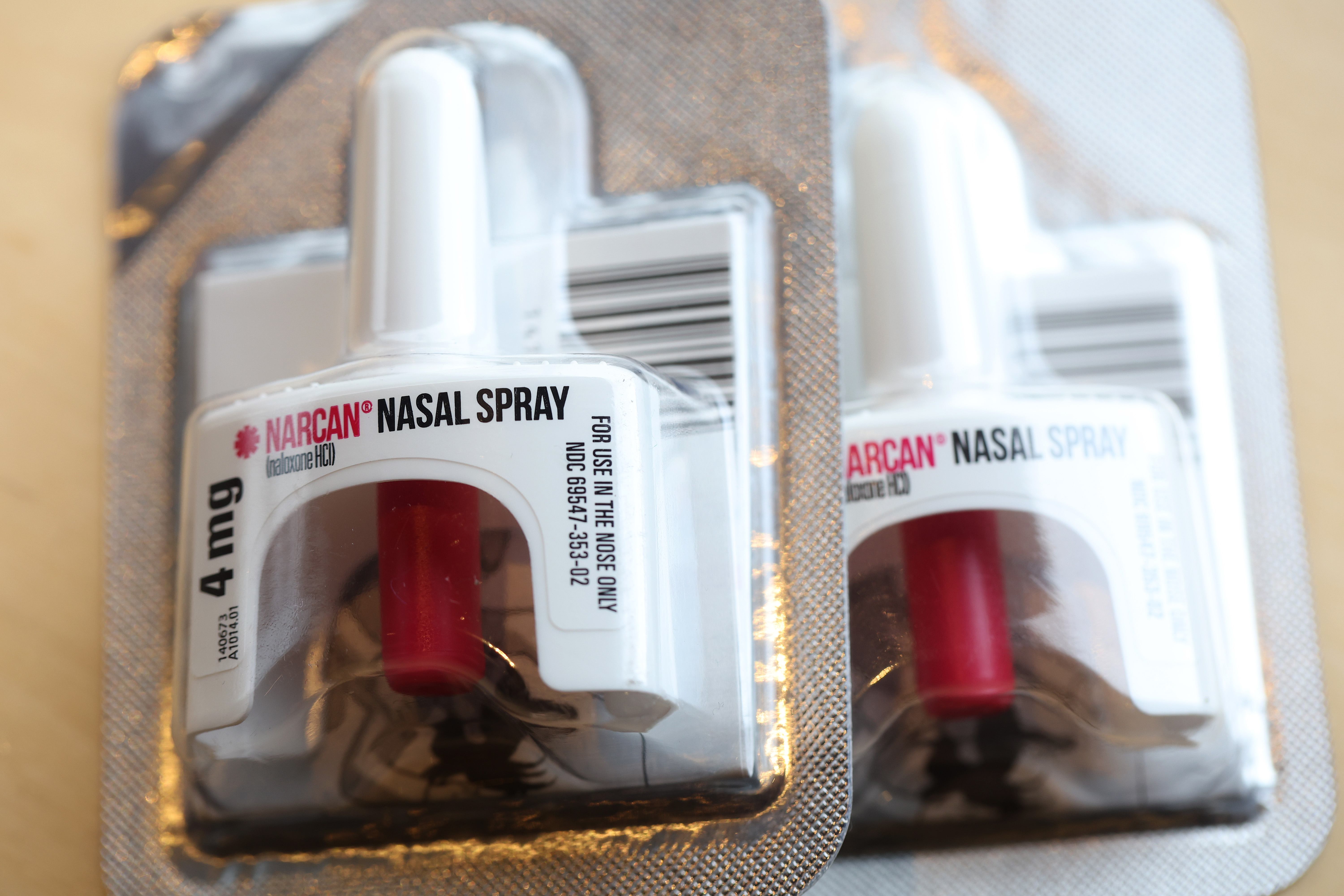A photo of two spray plungers of the naloxone spray Narcan.