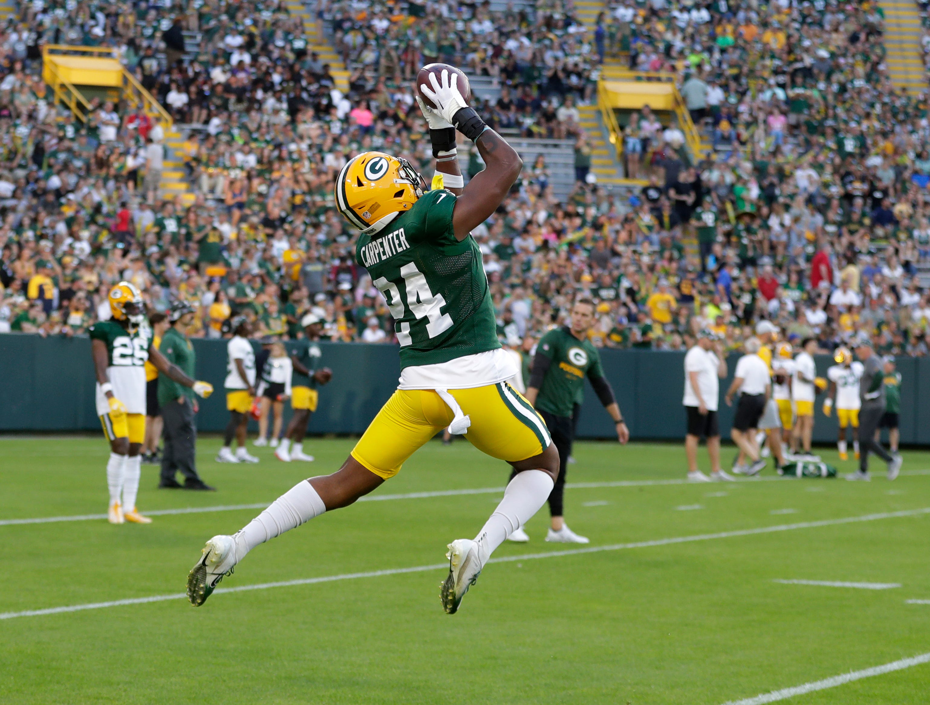 Green Bay Packers safety Tariq Carpenter (24) leaps to make a catch at Packers Family Night at Lambeau Field on Aug. 5, 2022, in Green Bay, Wis. Gpg Familynight 080522 Sk31
