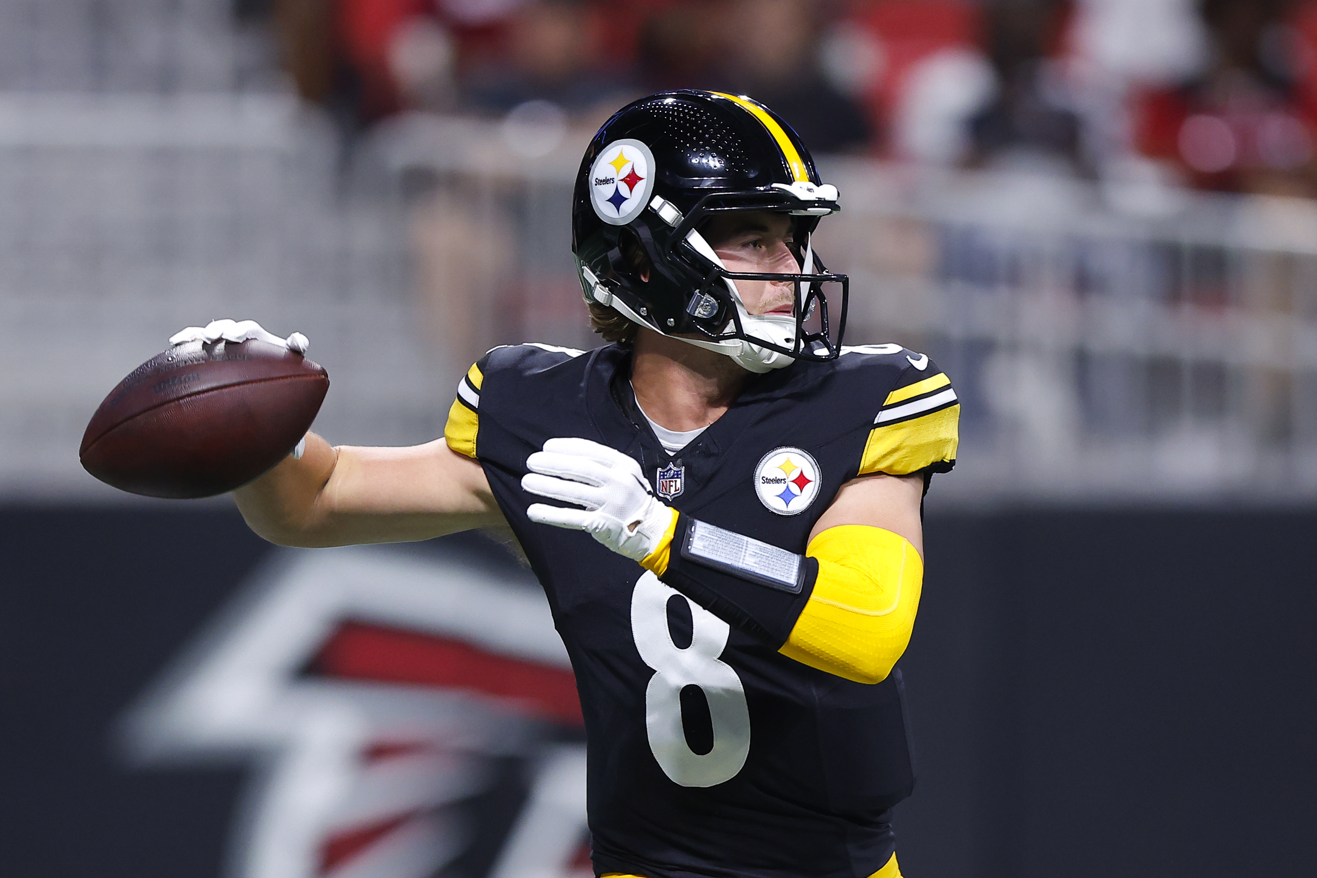 Kenny Pickett #8 of the Pittsburgh Steelers looks to pass during the first quarter of a preseason game against the Atlanta Falcons at Mercedes-Benz Stadium on August 24, 2023 in Atlanta, Georgia.