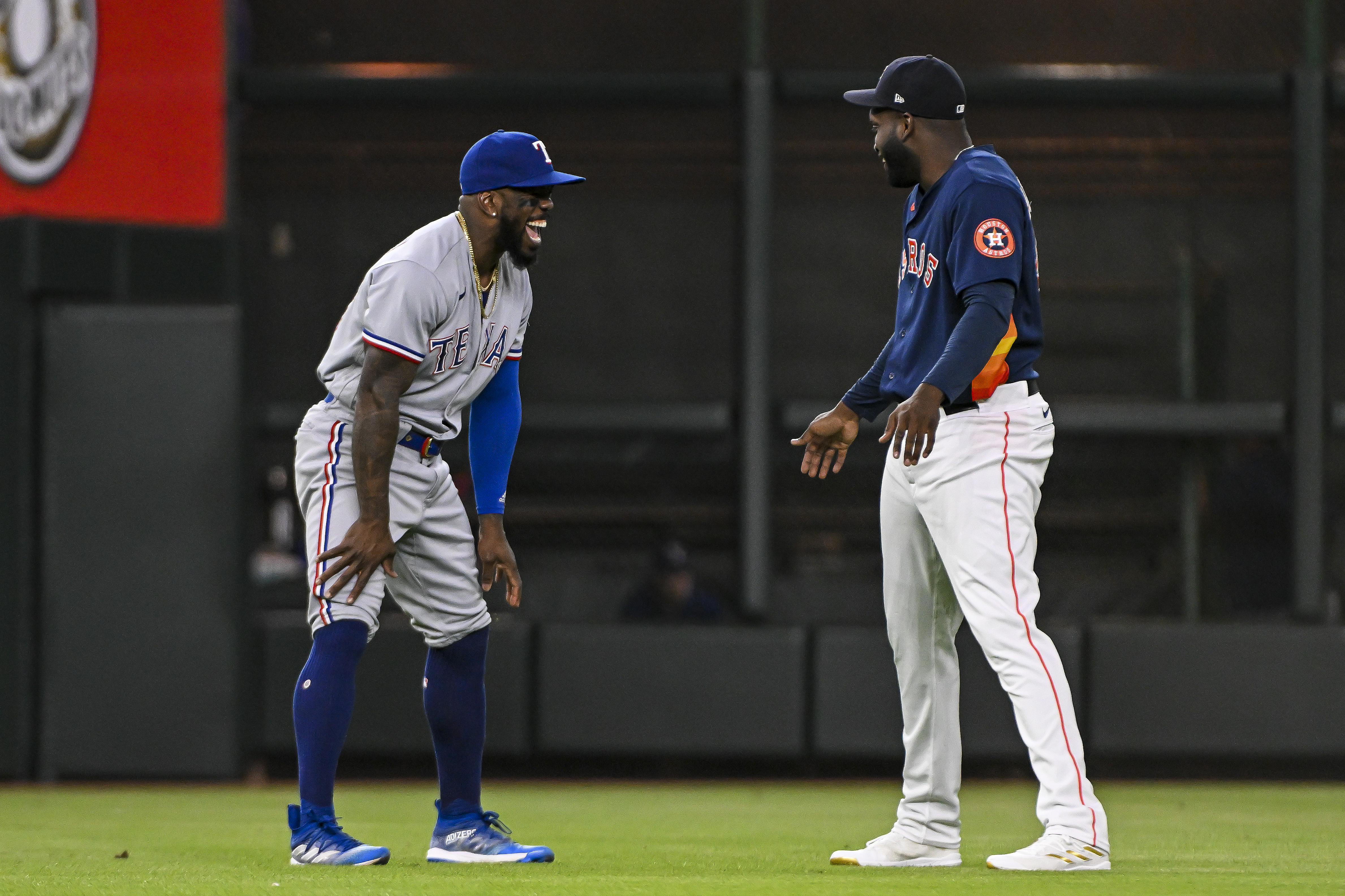 Marcus Semien of the Texas Rangers talks with Yordan Alvarez of the Houston Astros prior to the game at Minute Maid Park on July 26, 2023 in Houston, Texas.