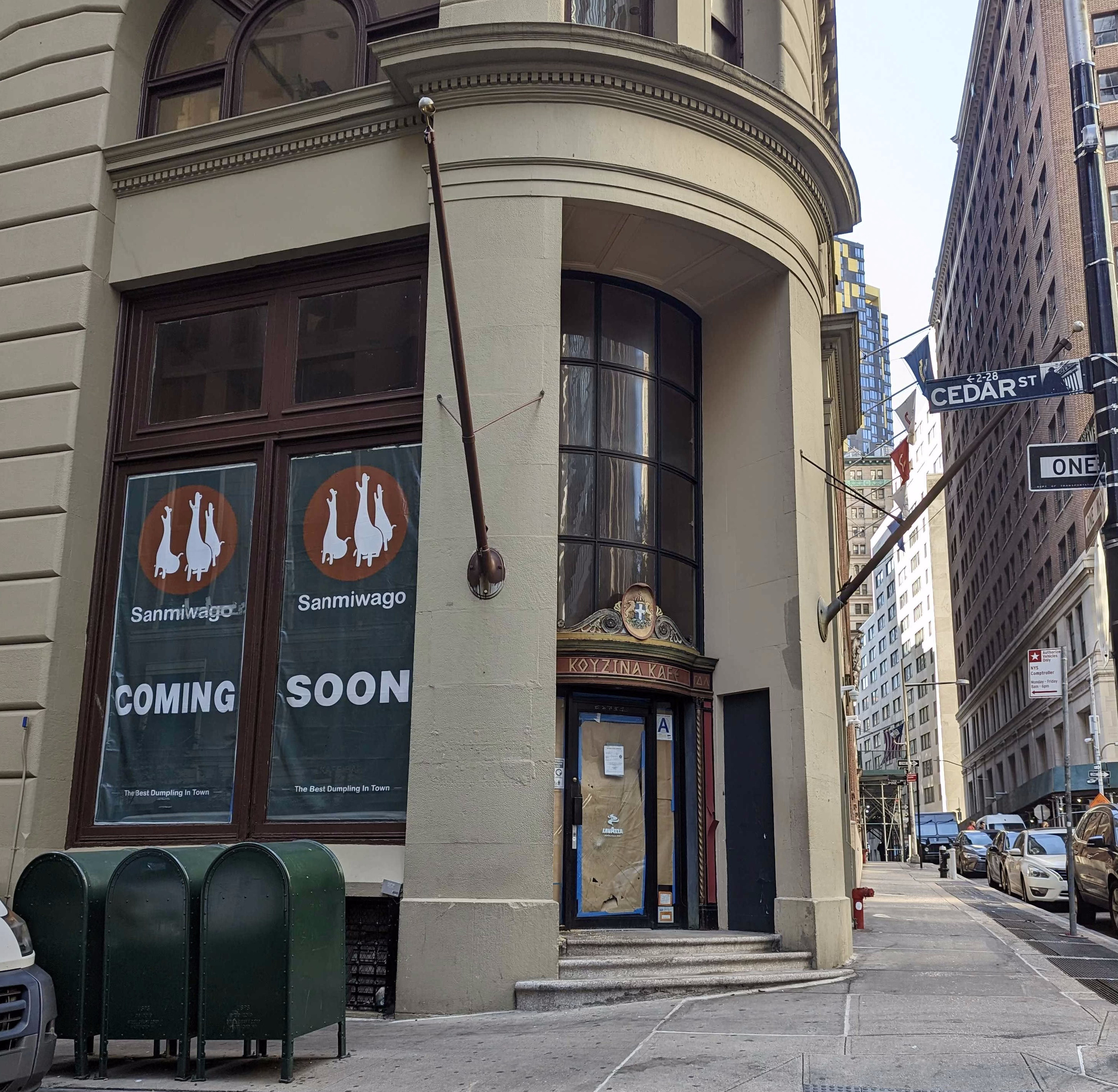 A restaurant, Sanmiwago, has “coming soon” signs on a building in the Financial District.