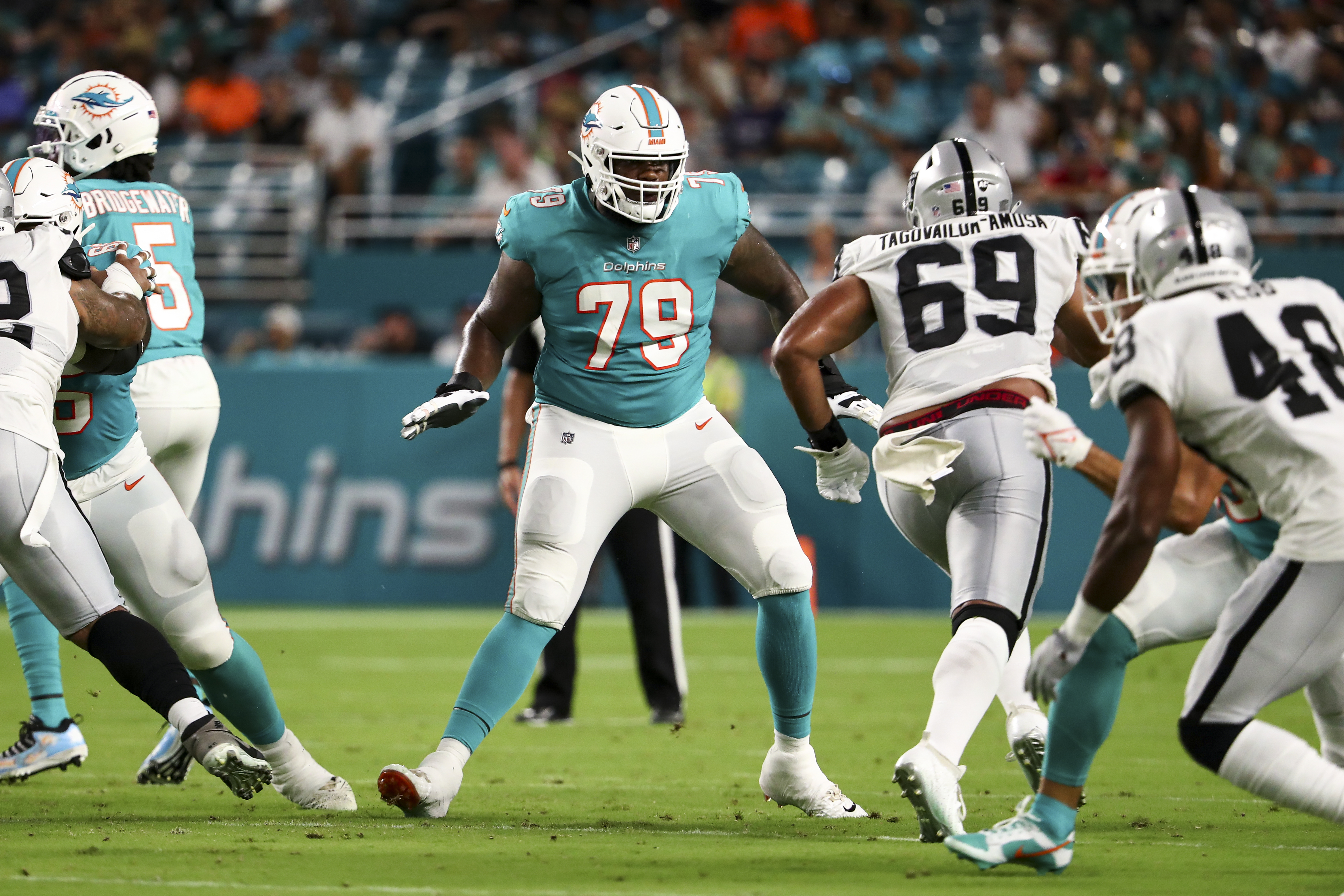 Larnel Coleman #79 of the Miami Dolphins blocks during a preseason NFL football game against the Las Vegas Raiders at Hard Rock Stadium on August 20, 2022 in Miami Gardens, Florida.