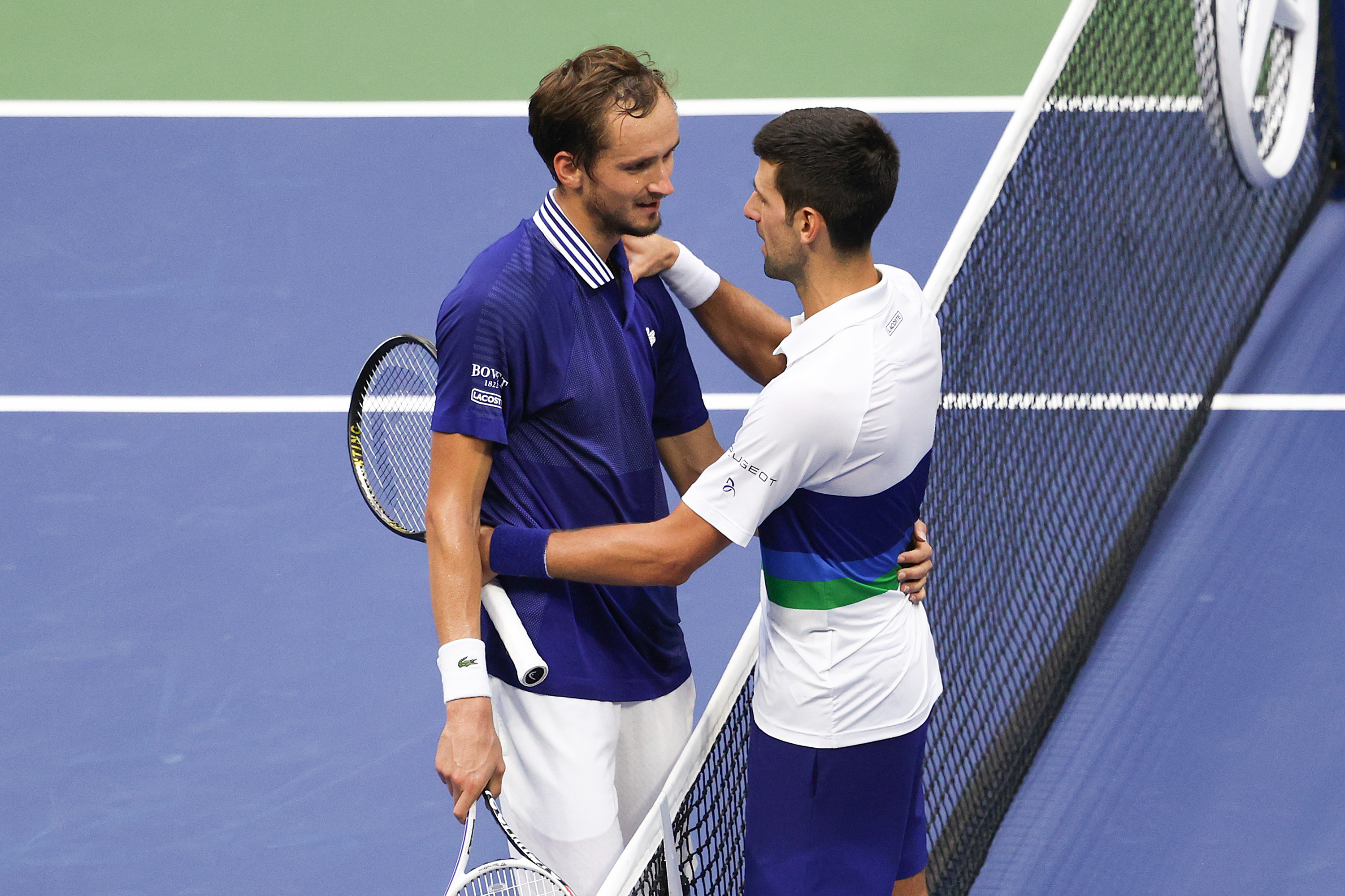 Daniil Medvedev (L) of Russia and Novak Djokovic (R) of Serbia talk at center court after Medvedev won their Men’s Singles final match on Day Fourteen of the 2021 US Open at the USTA Billie Jean King National Tennis Center on September 12, 2021 in the Flushing neighborhood of the Queens borough of New York City.