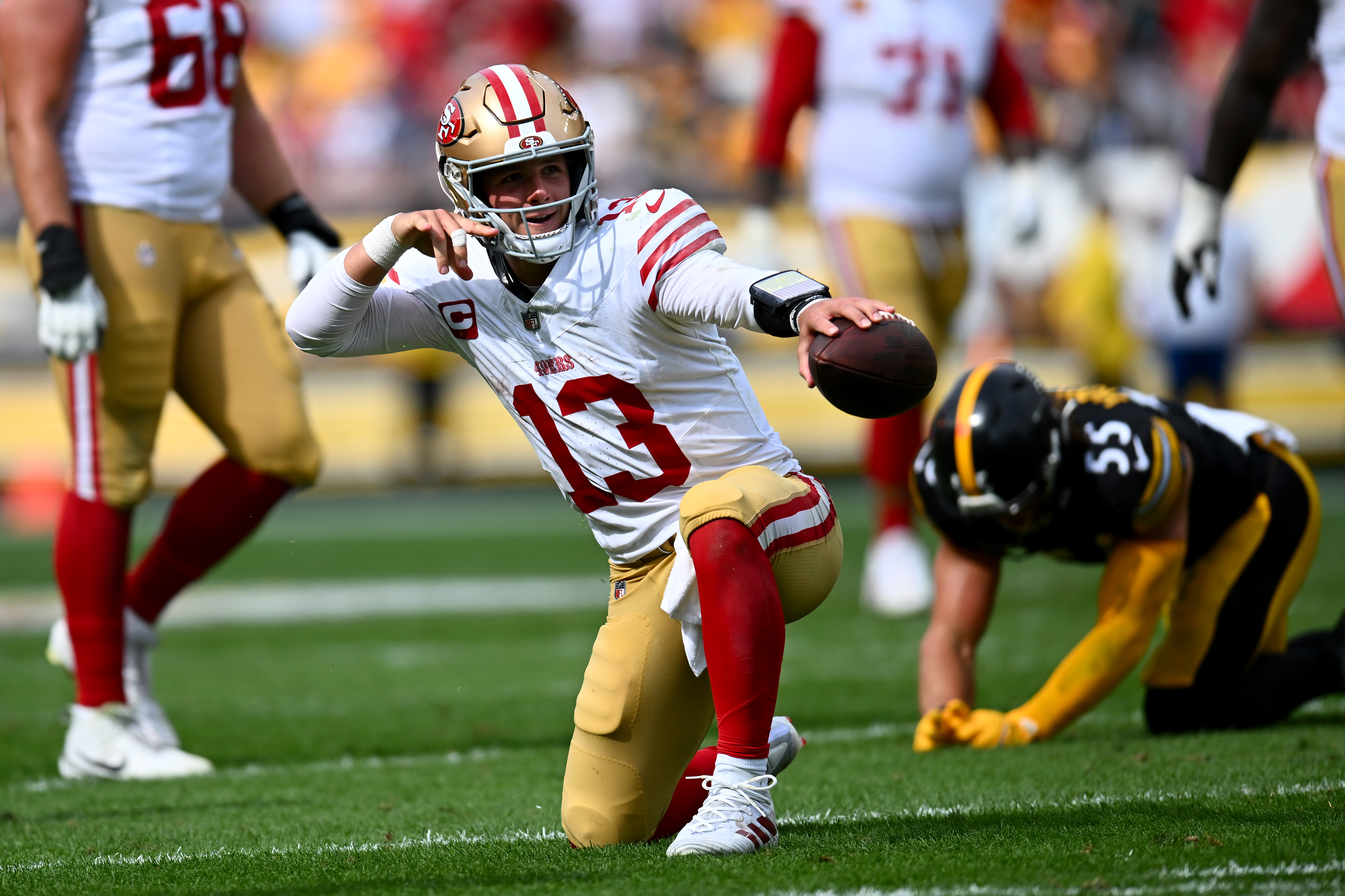 Brock Purdy #13 of the San Francisco 49ers reacts after running for a first down in the fourth quarter of a game against the Pittsburgh Steelers at Acrisure Stadium on September 10, 2023 in Pittsburgh, Pennsylvania.
