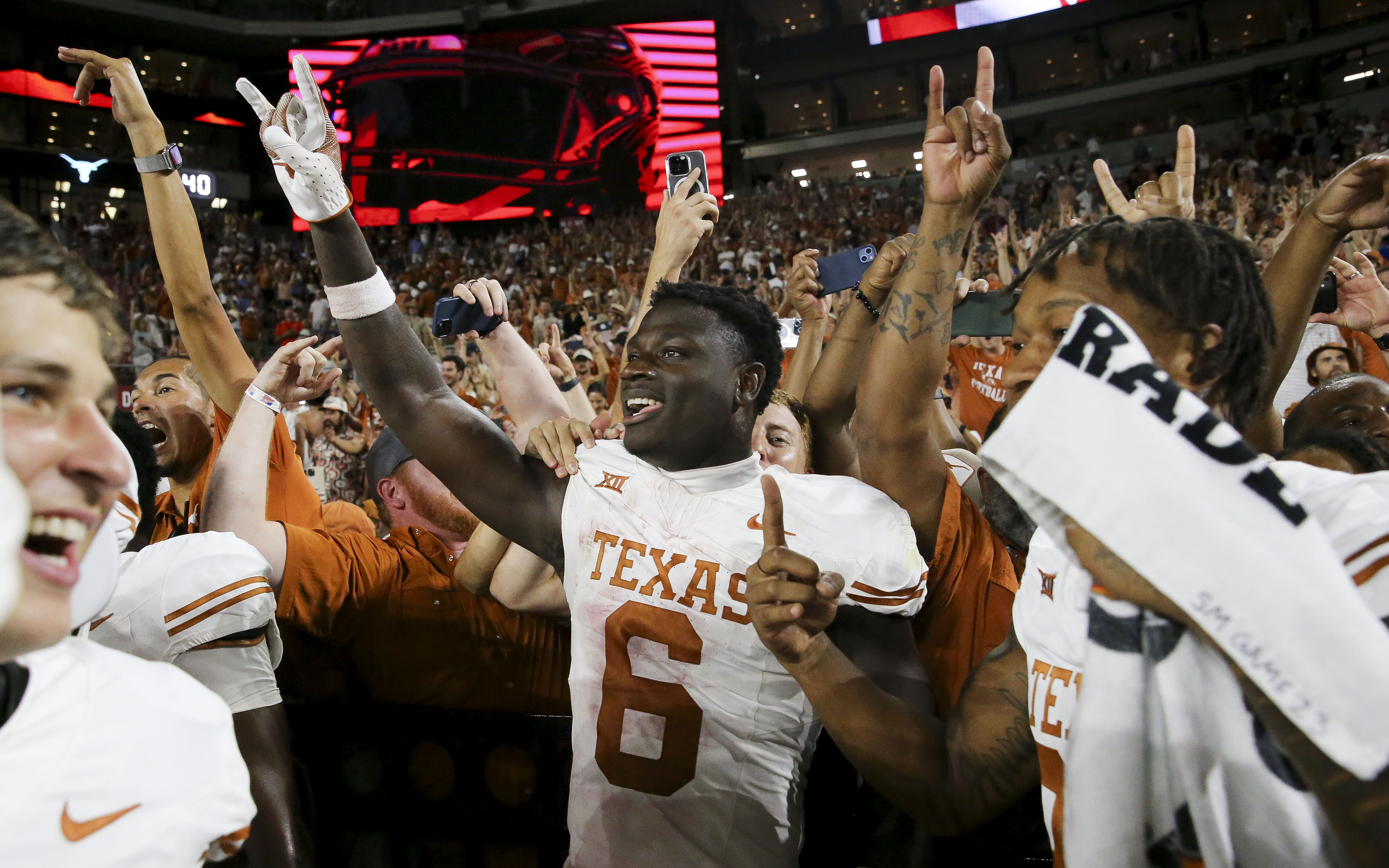 Texas players celebrate their Saturday win over Alabama.
