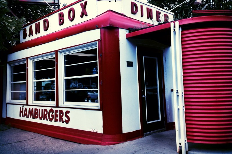 A red and white diner with the words “Band Box Diner” and “Hamburgers.” 
