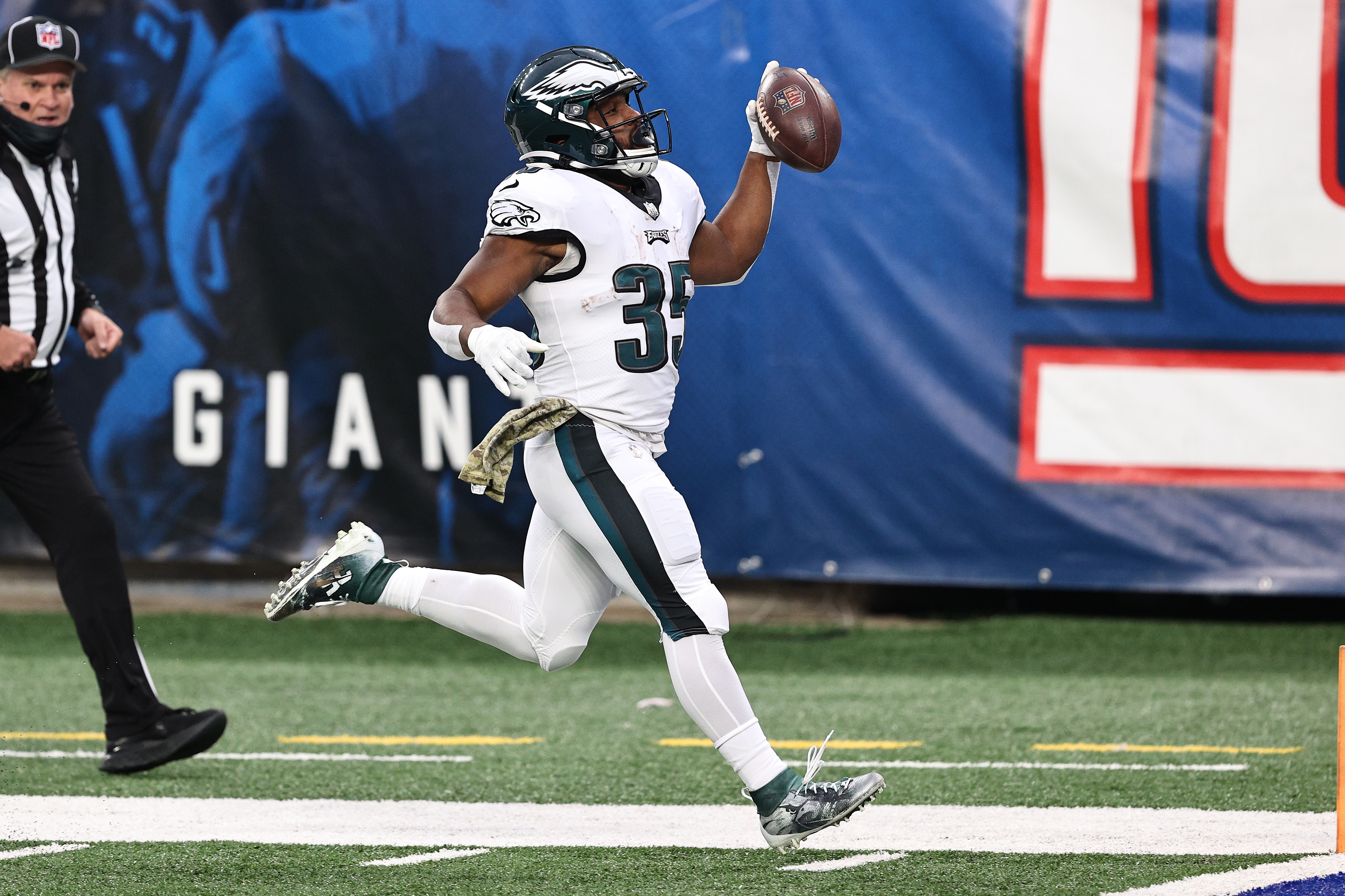 Boston Scott #35 of the Philadelphia Eagles runs the ball into the end zone for a touchdown during the second half against the New York Giants at MetLife Stadium on November 15, 2020 in East Rutherford, New Jersey.