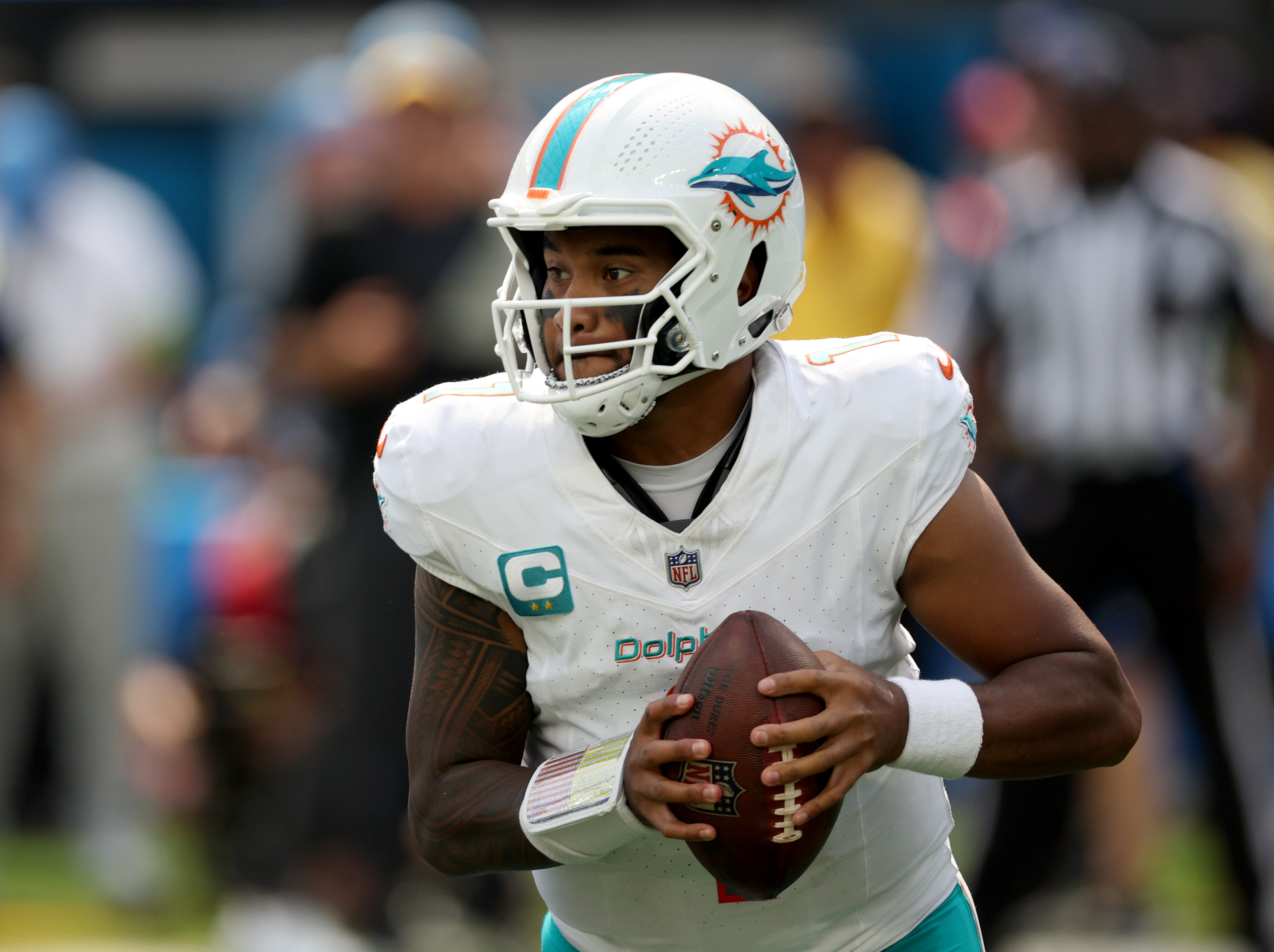 Tua Tagovailoa #1 of the Miami Dolphins drops back to pass during a 36-34 Dolphins win over the Los Angeles Chargers at SoFi Stadium on September 10, 2023 in Inglewood, California.