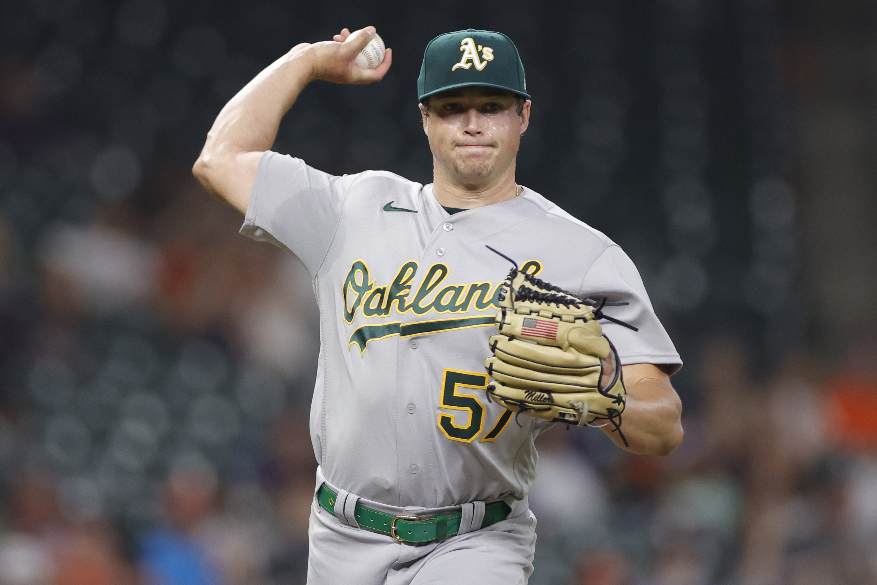 Mason Miller of the Oakland Athletics throws to first base during the first inning against the Houston Astros at Minute Maid Park on September 11, 2023 in Houston, Texas.