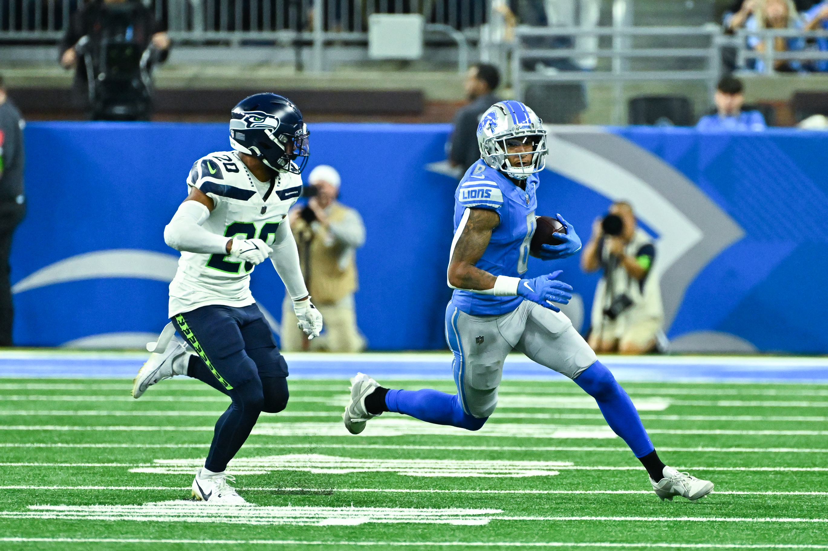 DETROIT, MI - SEPTEMBER 17: Detroit Lions wide receiver Josh Reynolds (8) runs wide away from Seattle Seahawks safety Julian Love (20) during the Detroit Lions versus the Seattle Seahawks game on Sunday September 17, 2023 at Ford Field in Detroit, MI.