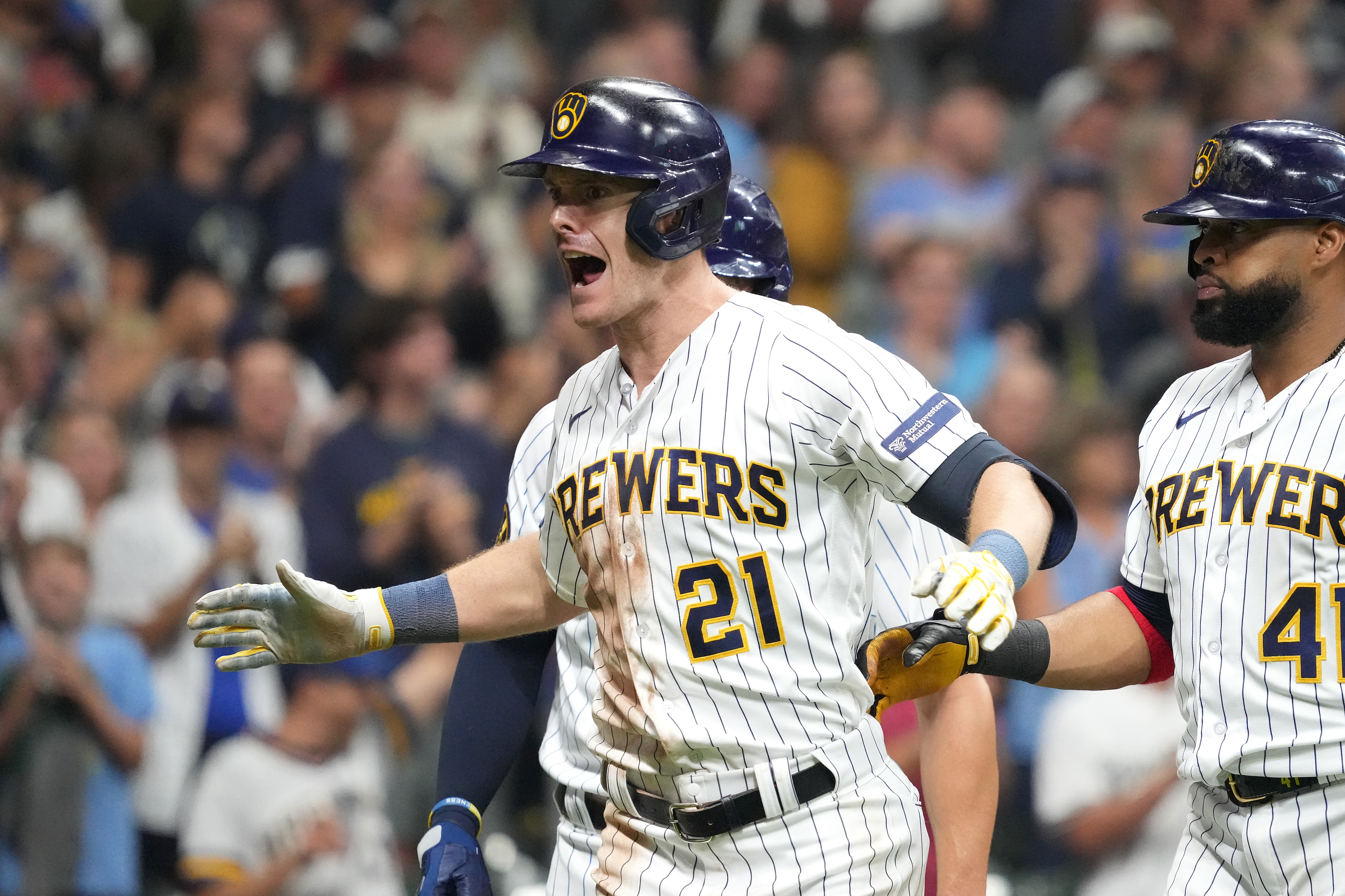 Mark Canha of the Milwaukee Brewers celebrates hitting a grand slam during the eighth inning against the Washington Nationals at American Family Field on September 16, 2023 in Milwaukee, Wisconsin.