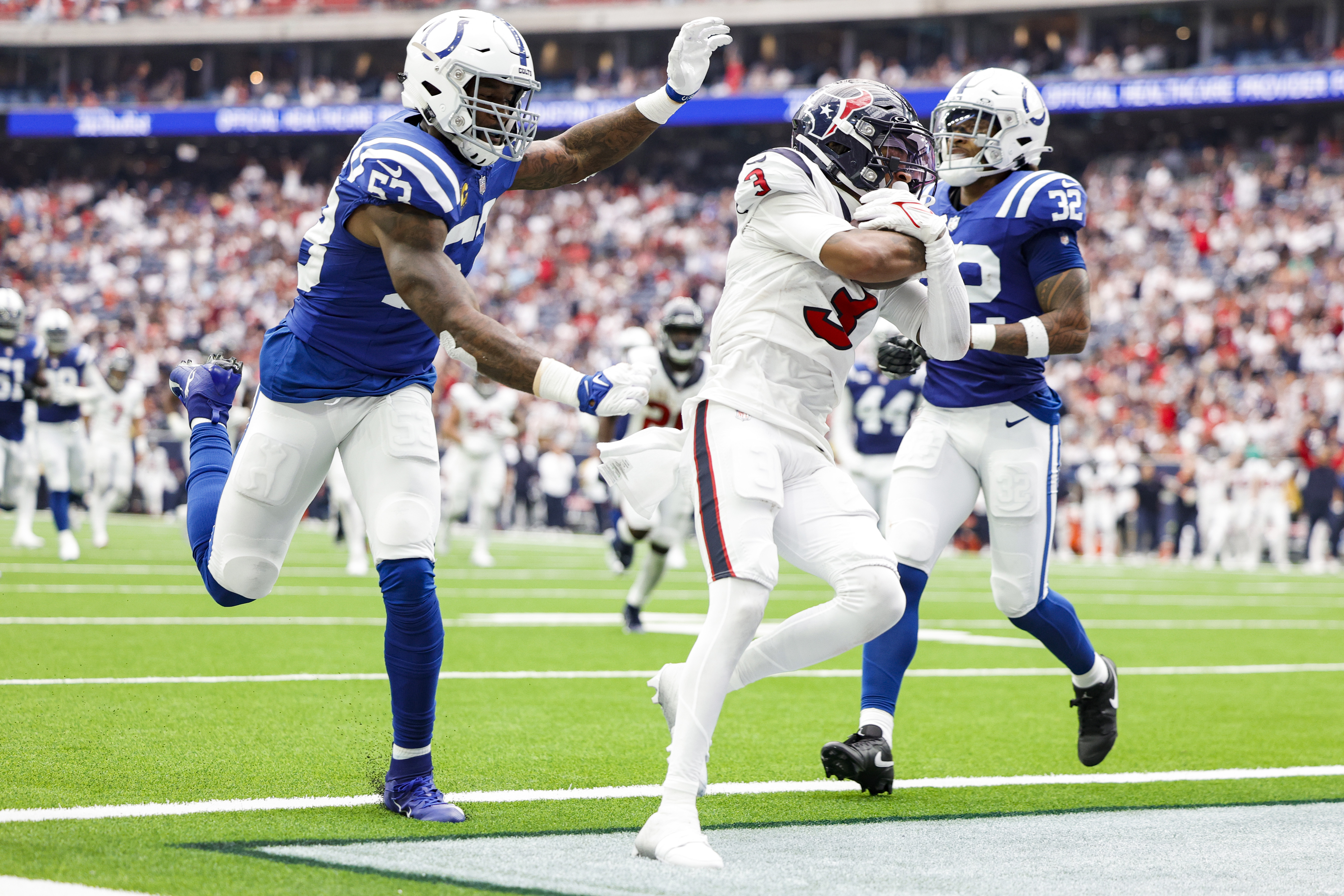 Tank Dell of the Houston Texans scores a receiving touchdown during the fourth quarter against the Indianapolis Colts at NRG Stadium on September 17, 2023 in Houston, Texas.