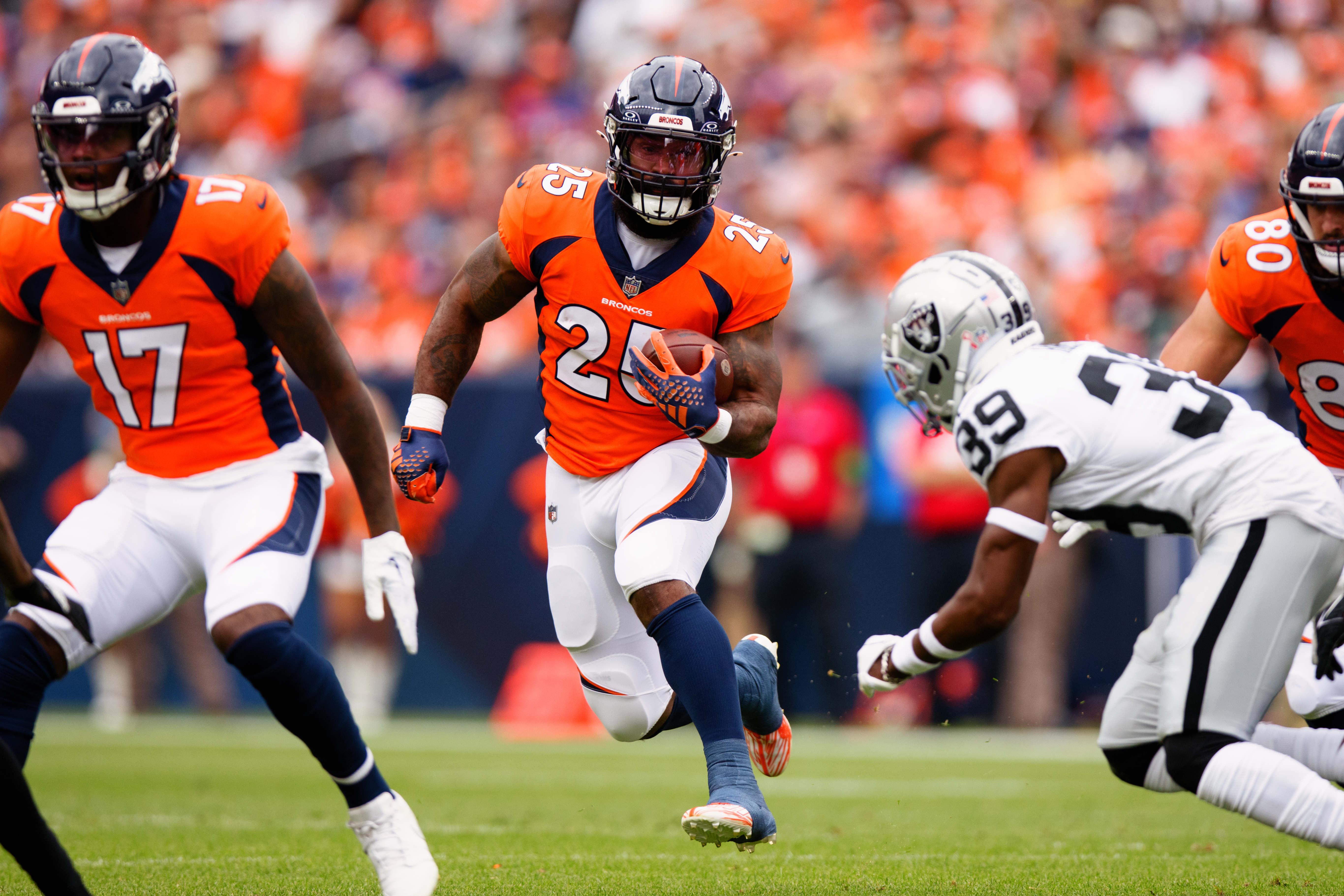 Running back Samaje Perine of the Denver Broncos runs with the football during the first quarter against the Las Vegas Raiders at Empower Field at Mile High on September 10, 2023 in Denver, Colorado.