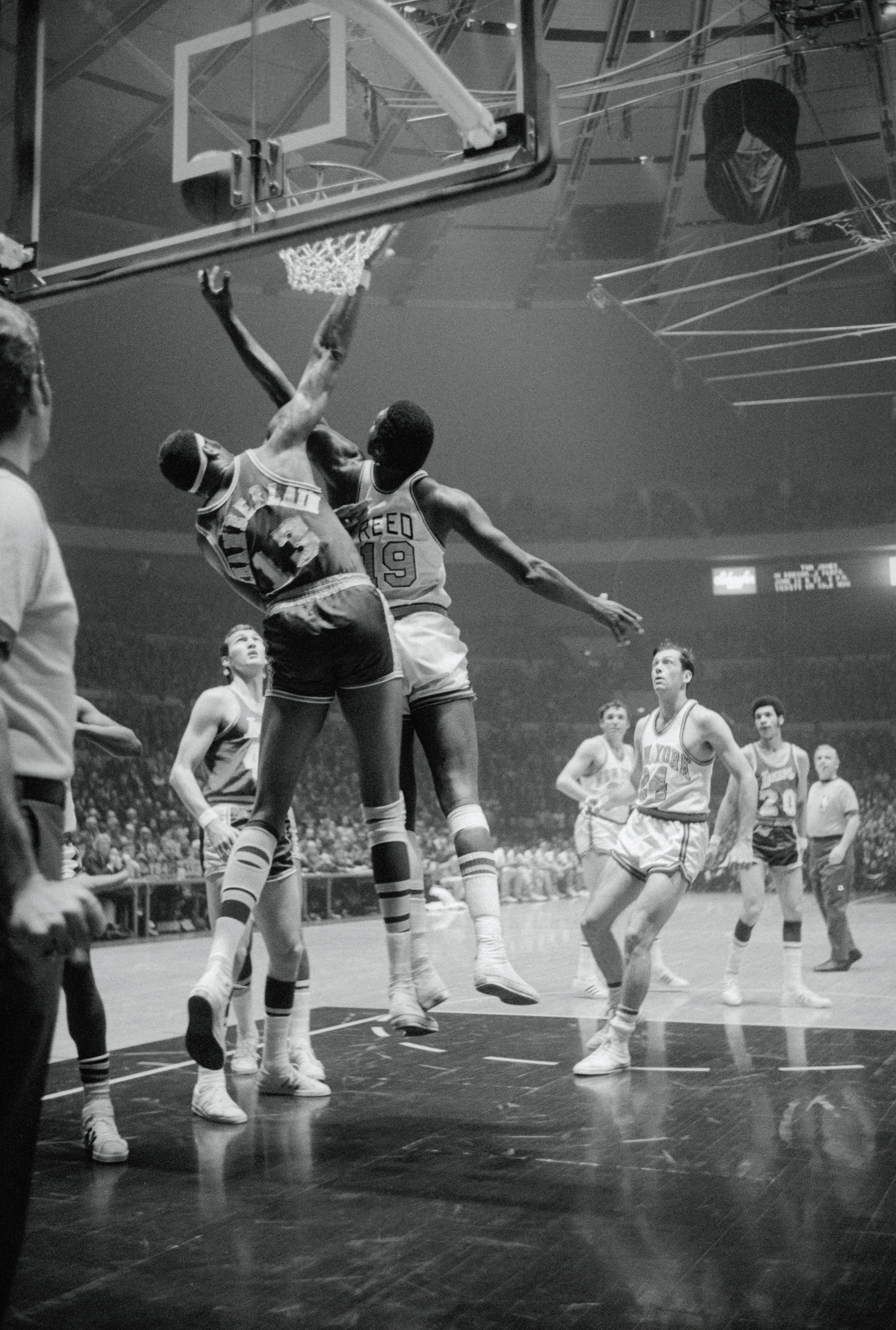 Wilt Chamberlain and Willis Reed Going for Basketball