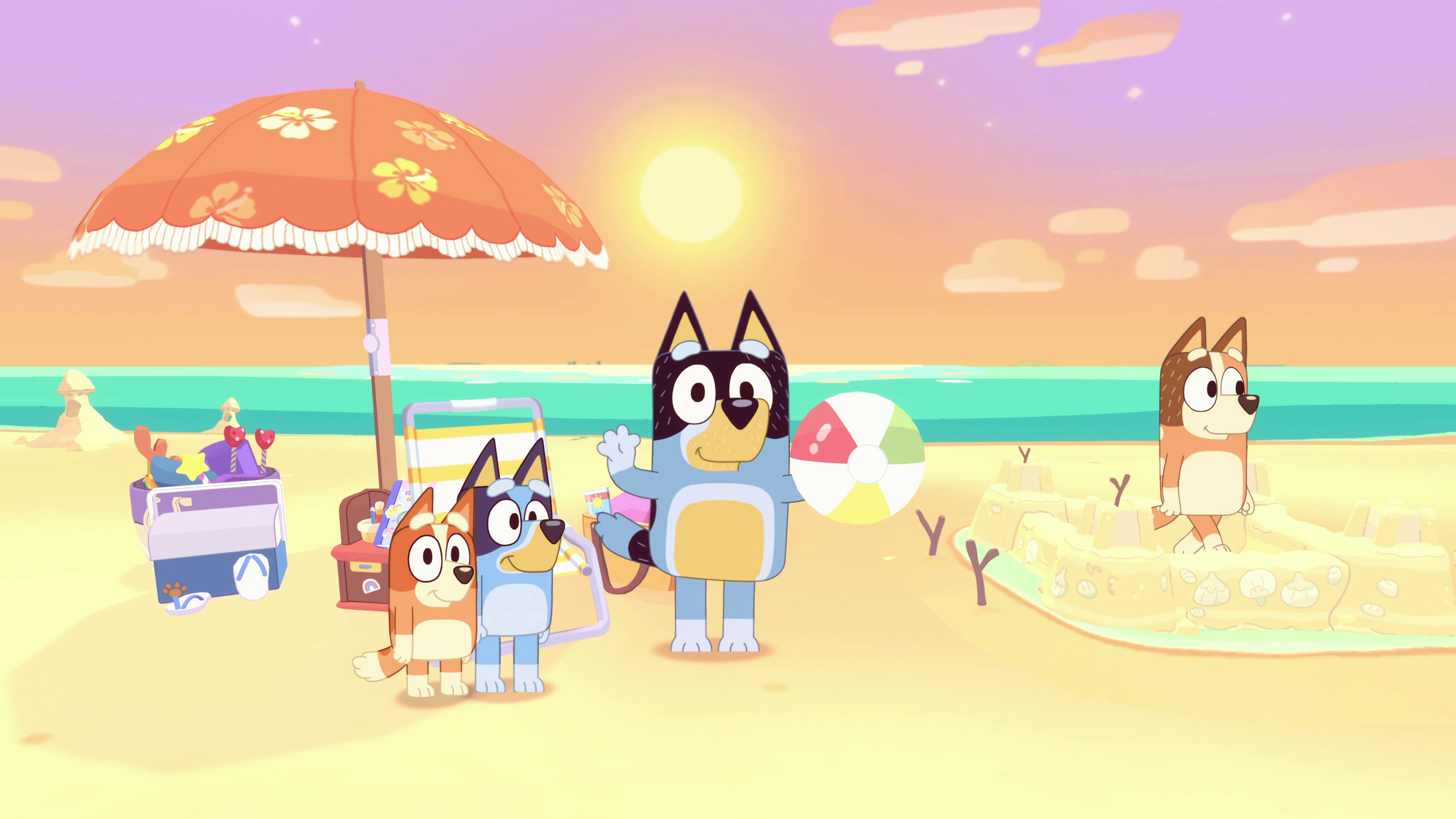 A family of cartoon dogs at the beach.