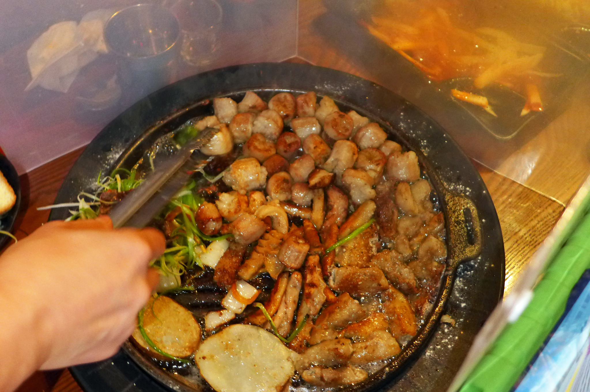 A round pan with nuggets of organ meat of various sorts.