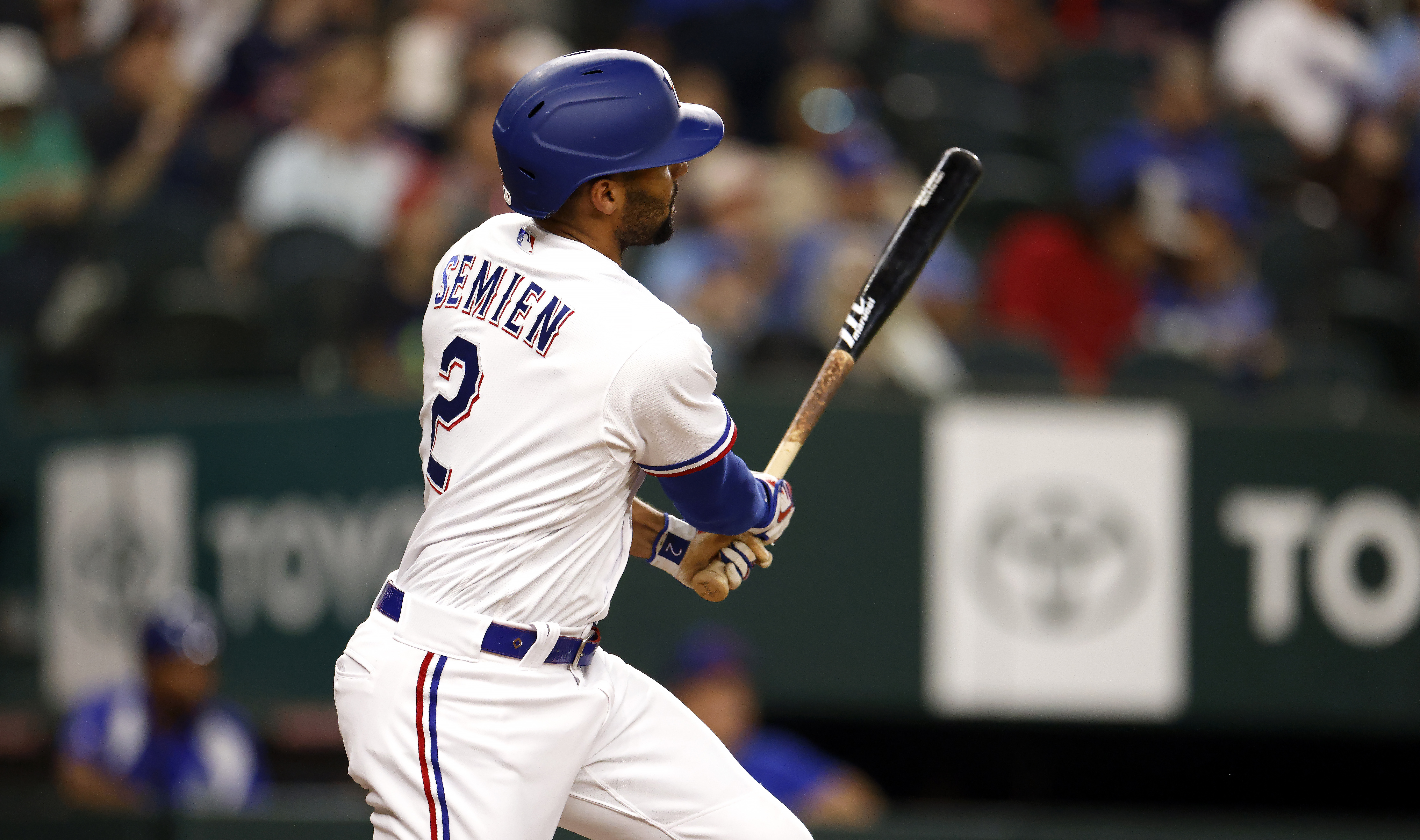 Marcus Semien of the Texas Rangers hits a leadoff-home run against the Boston Red Sox during the first inning at Globe Life Field on September 18, 2023 in Arlington, Texas.