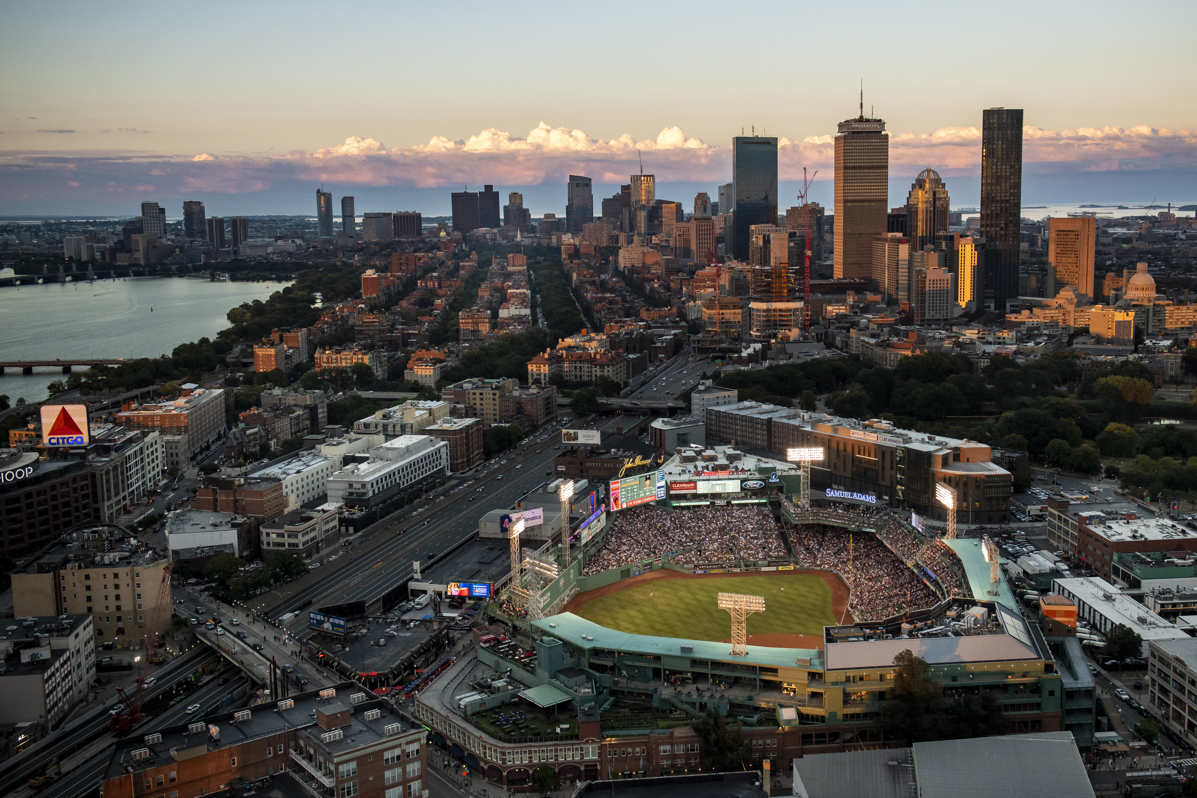 An aerial view of Boston showing landmarks like Fenway Park and the Citgo sign.