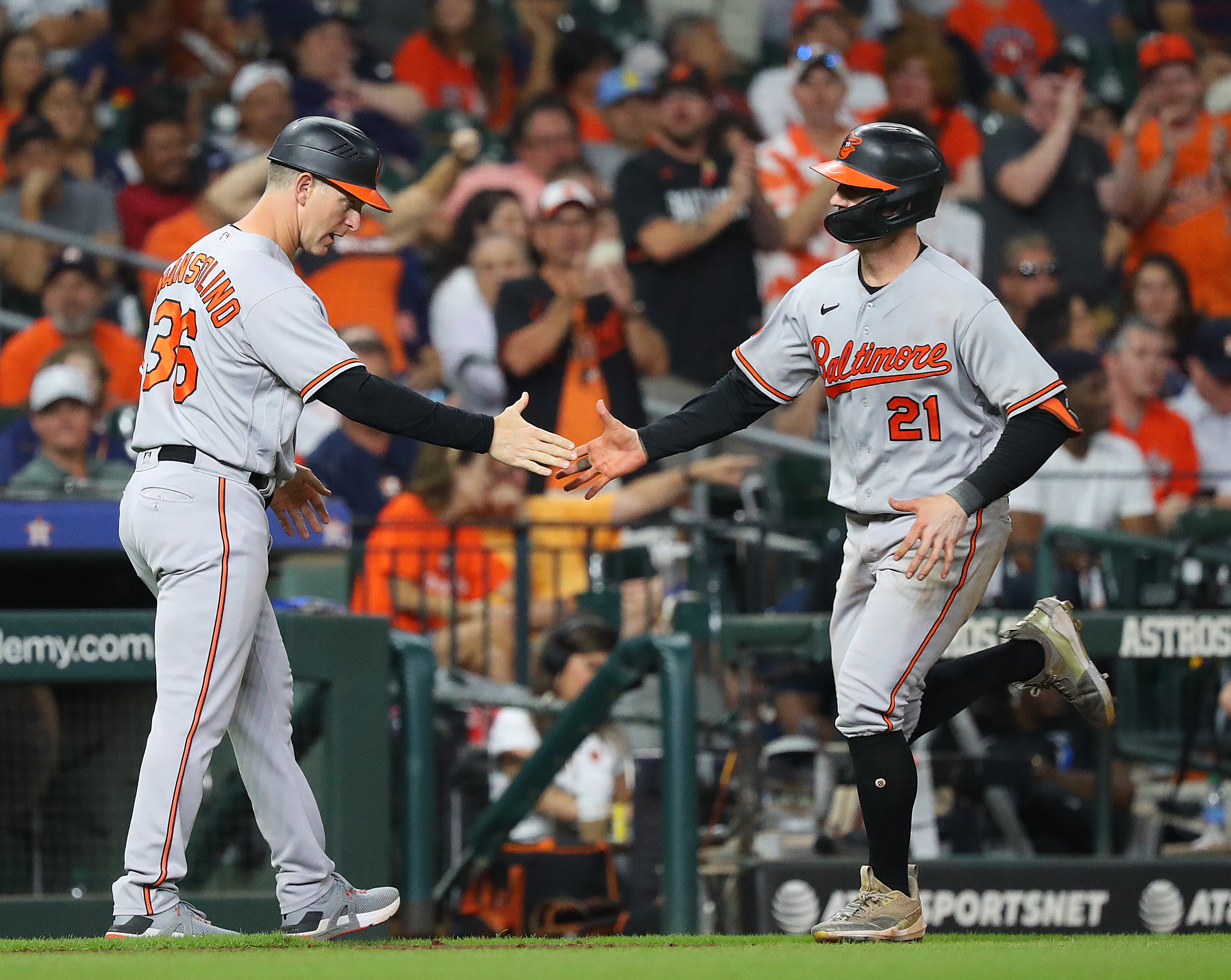 Austin Hays of the Baltimore Orioles receives congratulations from Tony Mansolino after hitting a home run in the seventh inning at Minute Maid Park on September 19, 2023 in Houston, Texas.