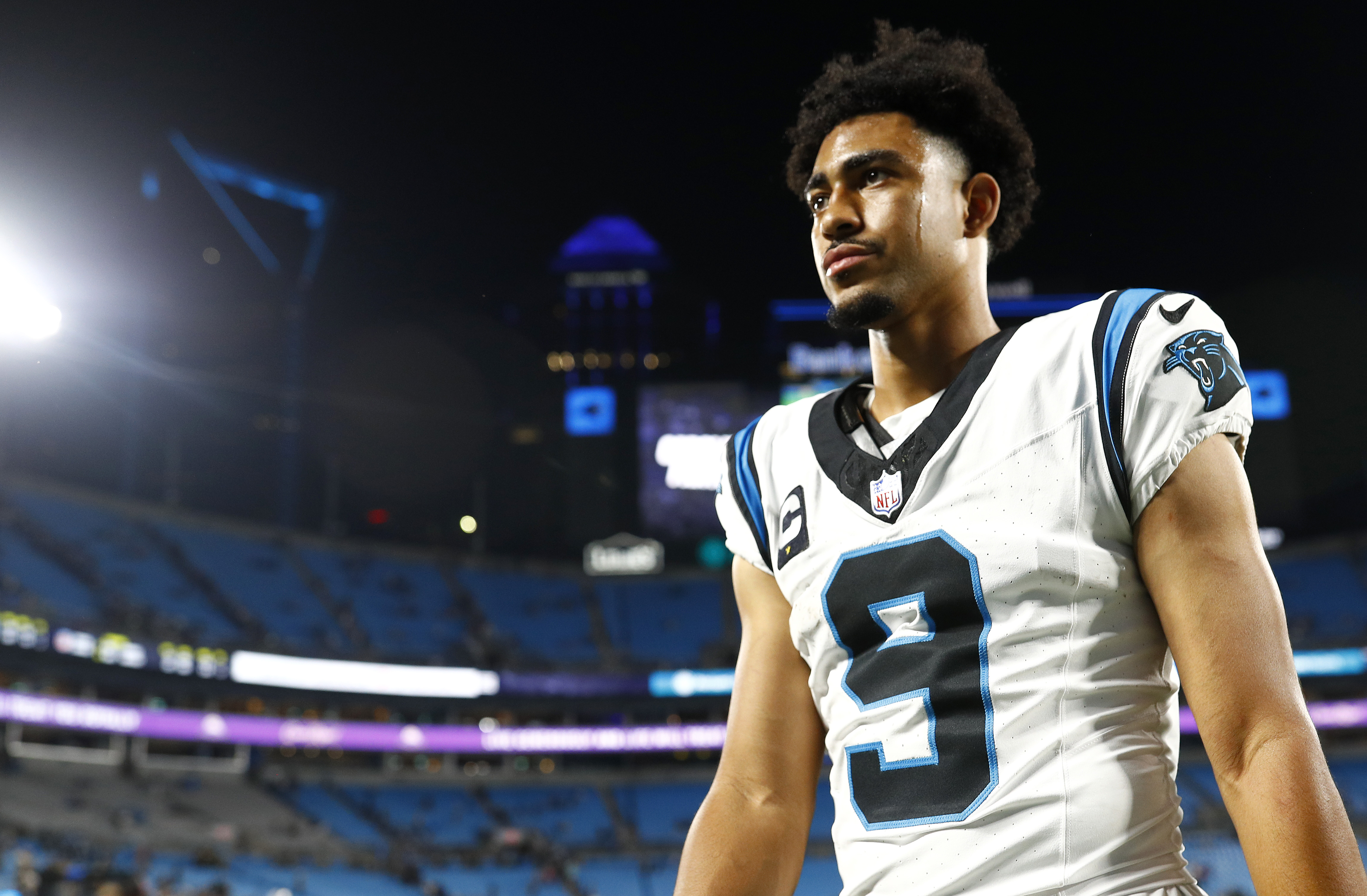 Bryce Young #9 of the Carolina Panthers walks off the field after being defeated by the New Orleans Saints in the game at Bank of America Stadium on September 18, 2023 in Charlotte, North Carolina.