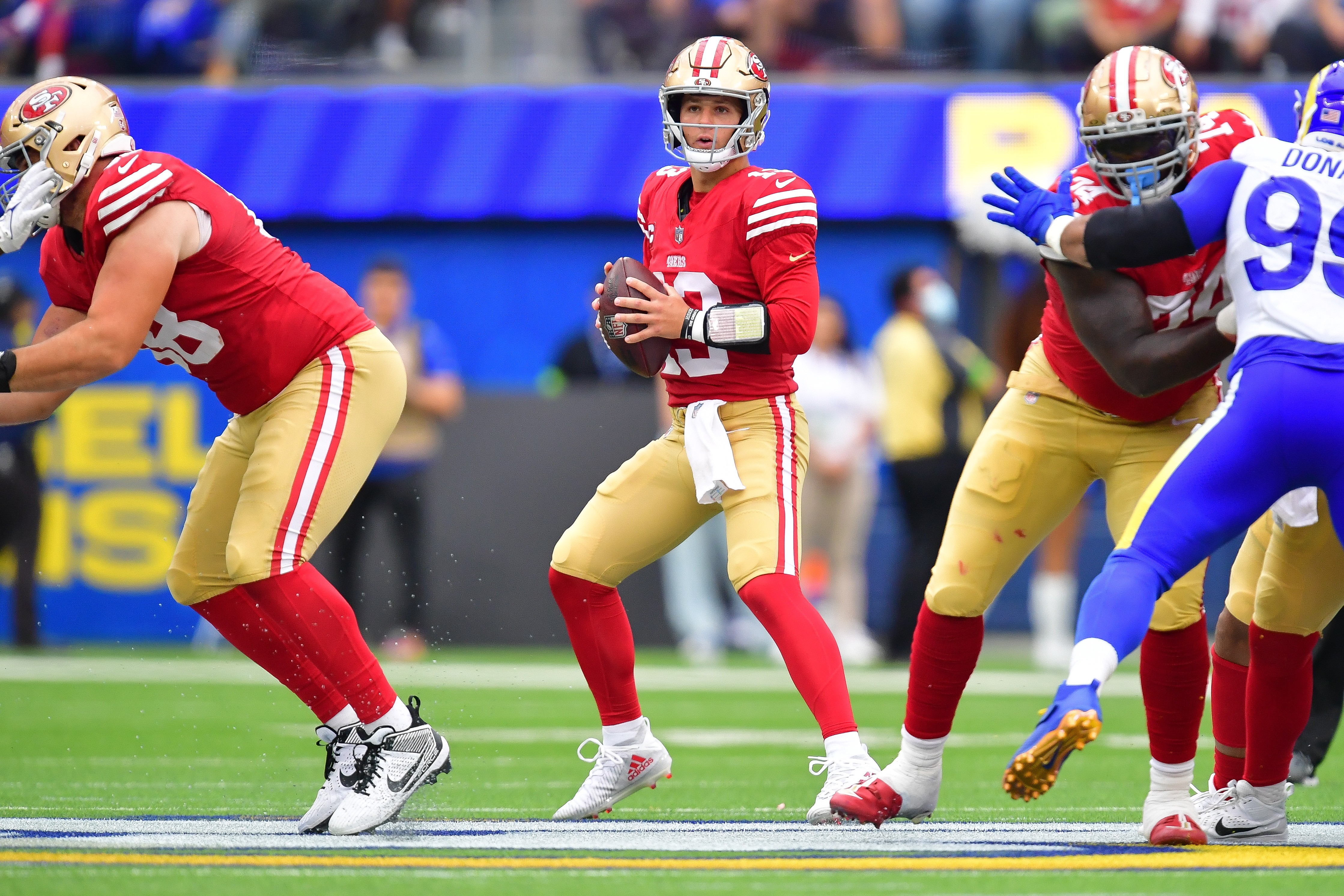 San Francisco 49ers quarterback Brock Purdy (13) drops back to pass against the Los Angeles Rams during the first half at SoFi Stadium.