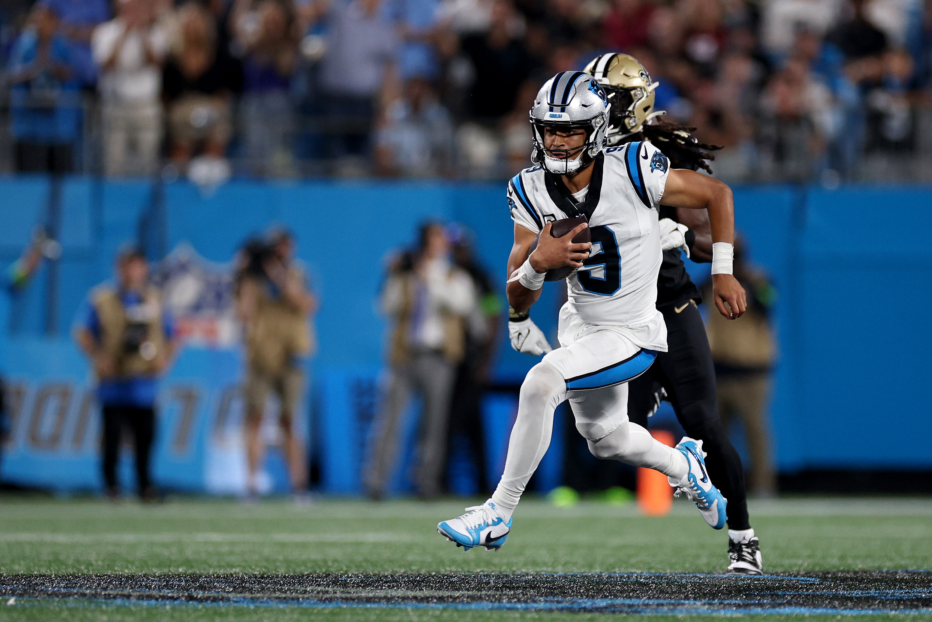 Bryce Young #9 of the Carolina Panthers runs the ball against the New Orleans Saints during the fourth quarter in the game at Bank of America Stadium on September 18, 2023 in Charlotte, North Carolina.