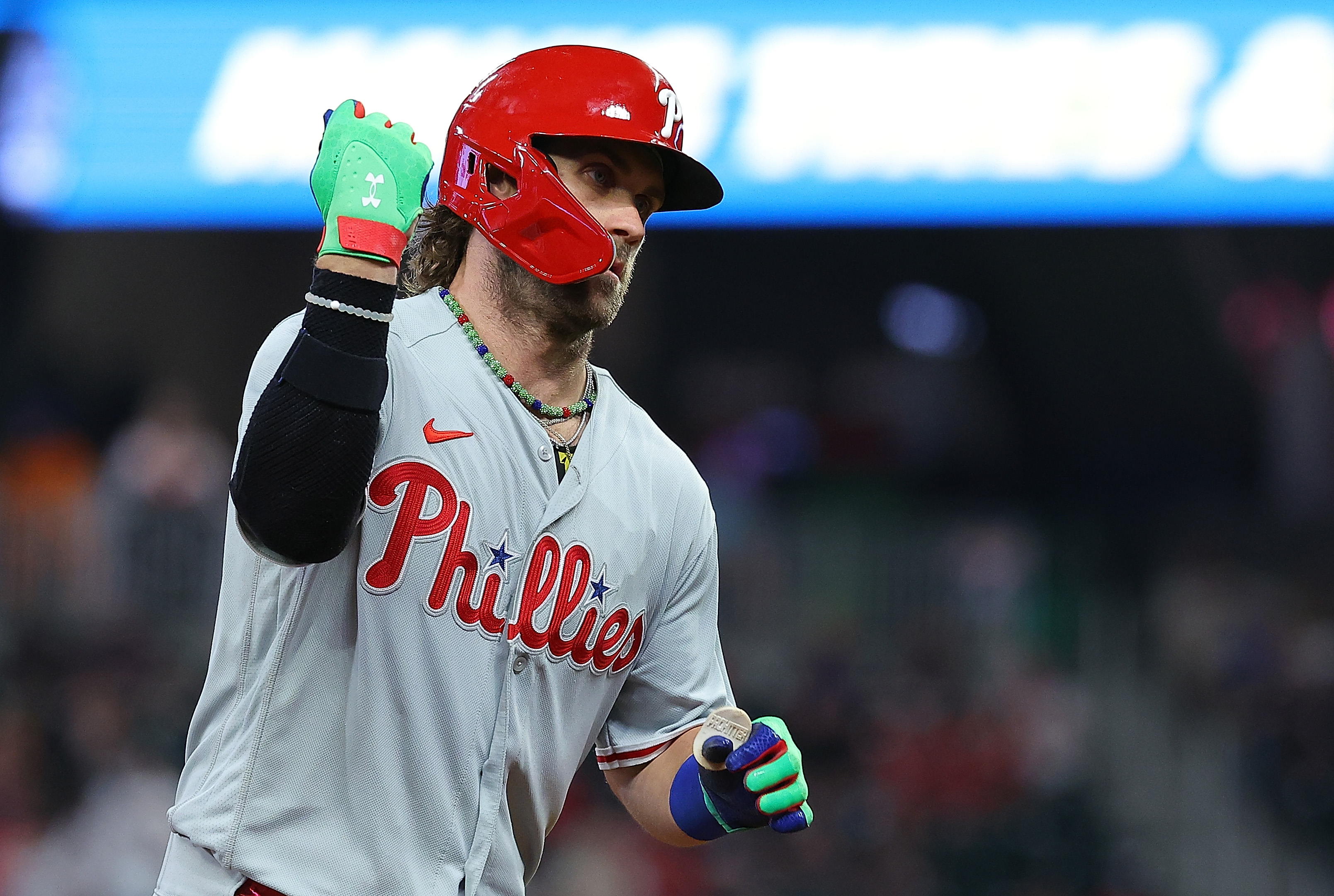 Bryce Harper of the Philadelphia Phillies reacts as he rounds third base after hitting a three-run homer in the sixth inning against the Atlanta Braves at Truist Park on September 19, 2023 in Atlanta, Georgia.