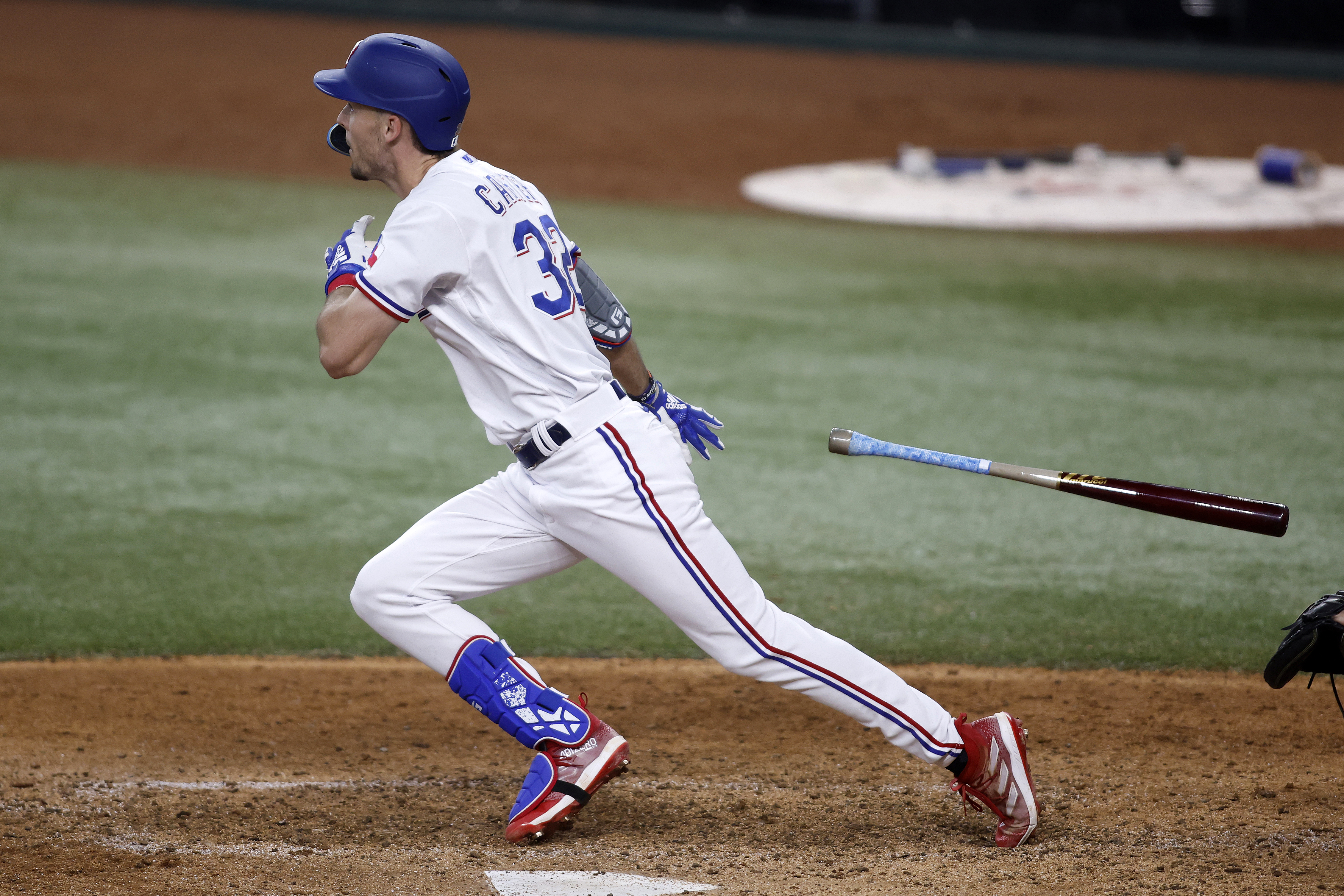 Evan Carter of the Texas Rangers hits a two-run home run in the sixth inning against the Boston Red Sox at Globe Life Field on September 20, 2023 in Arlington, Texas.