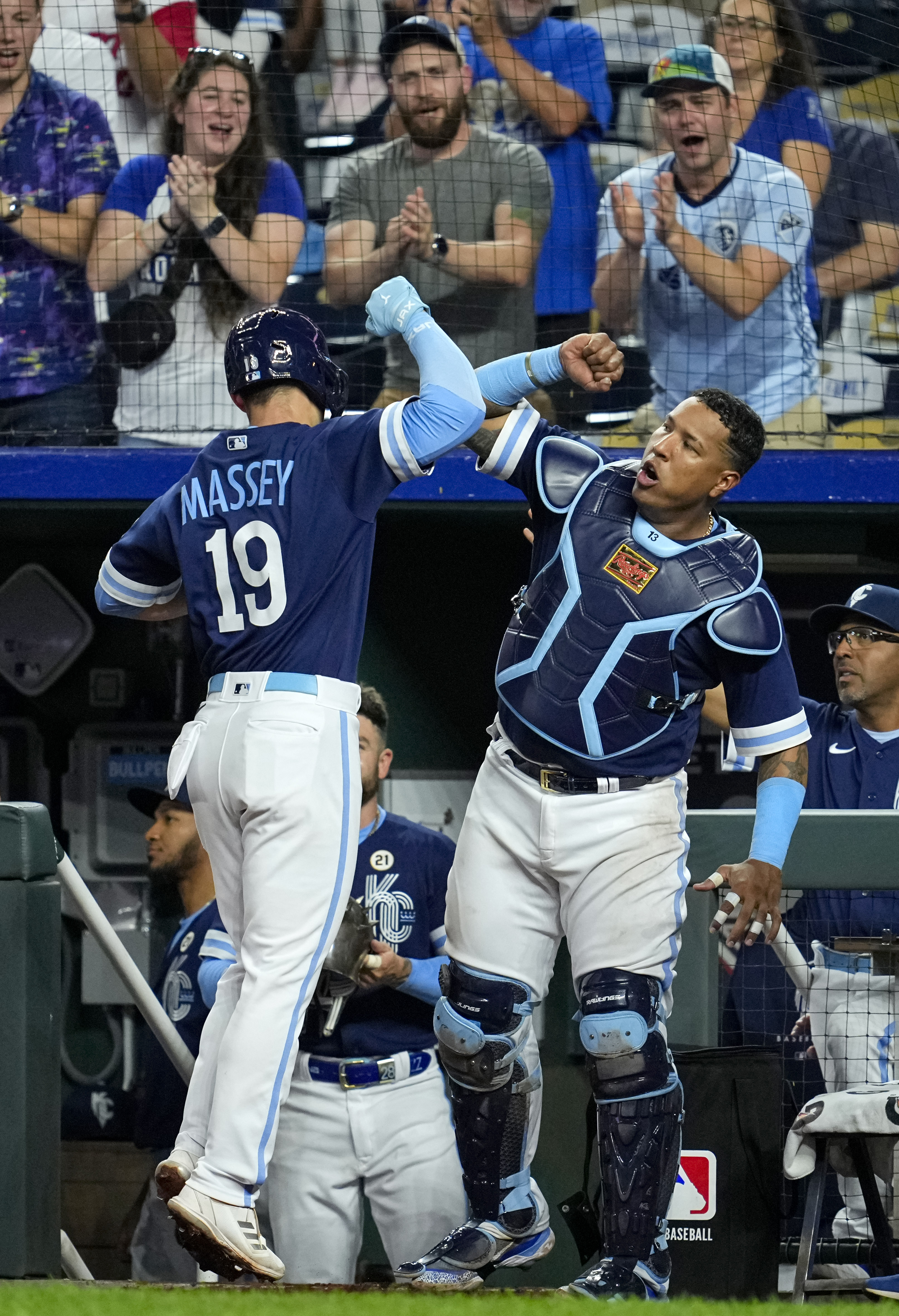 Kansas City Royals second baseman Michael Massey (19) celebrates with catcher Salvador Perez (21) after hitting a home run during the eighth inning against the Houston Astros at Kauffman Stadium. Mandatory Credit: Jay Biggerstaff