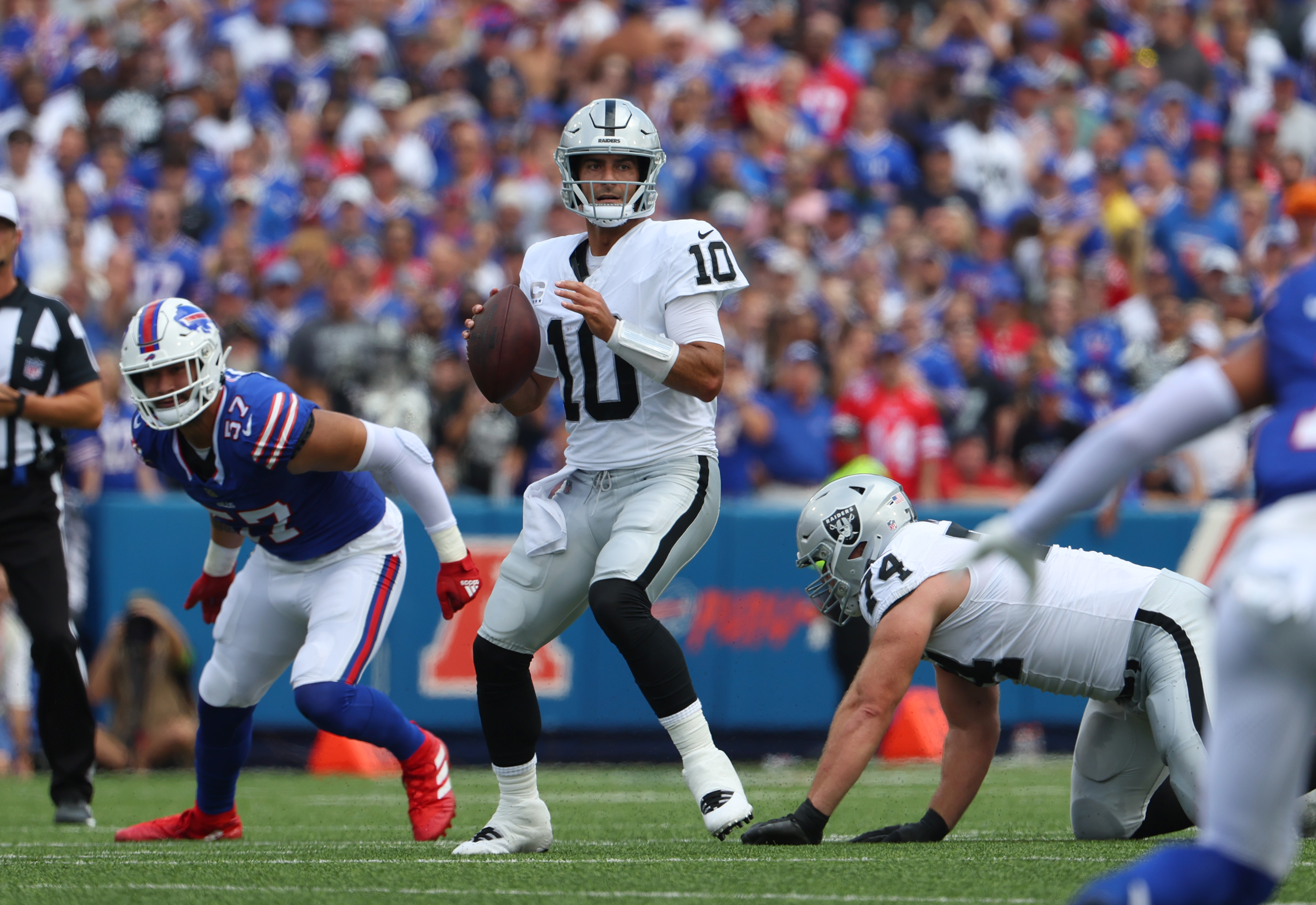 Jimmy Garoppolo #10 of the Las Vegas Raiders drops back to throw a pass against the Buffalo Bills at Highmark Stadium on September 17, 2023 in Orchard Park, New York.