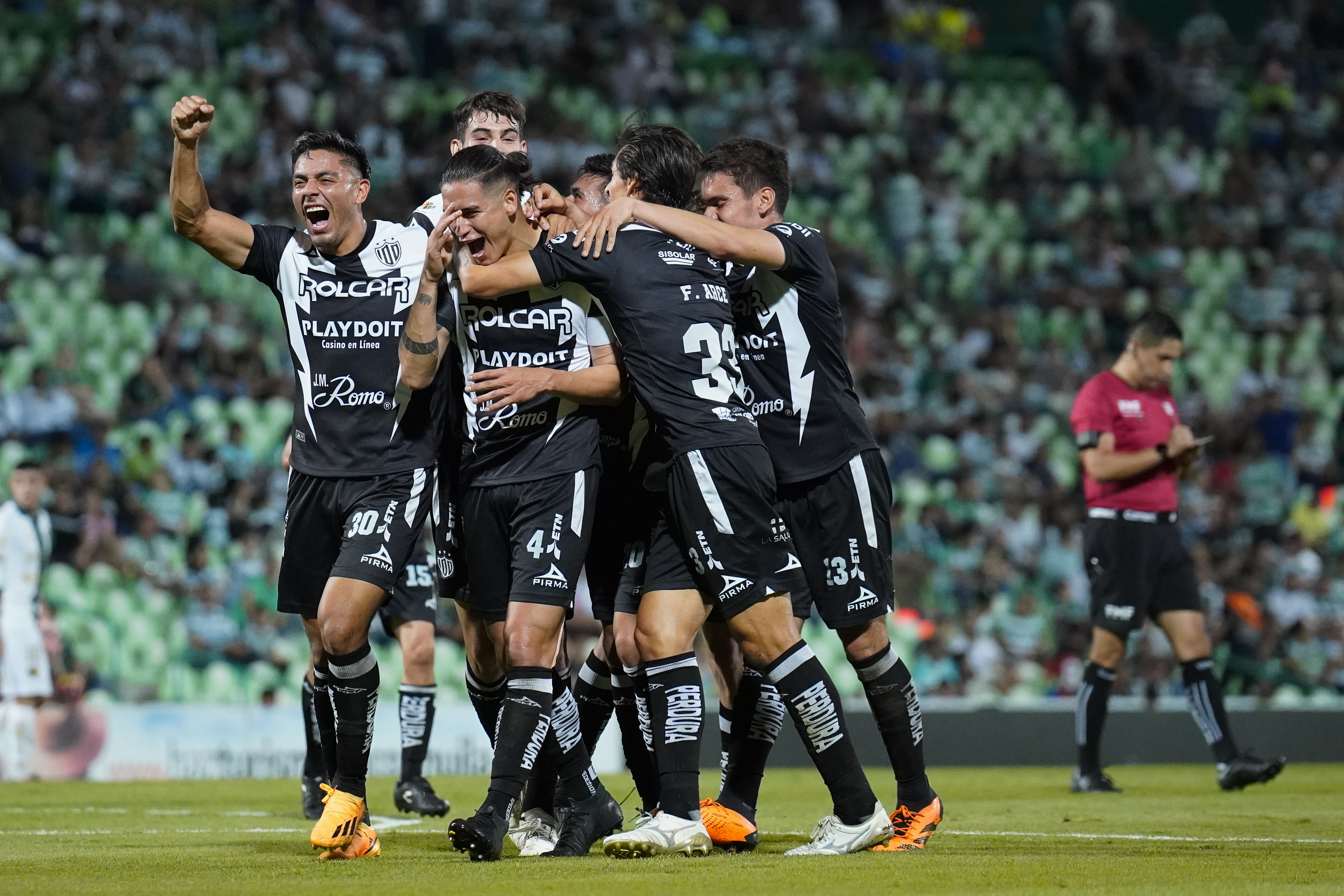 Alexis Pena (C) of Necaxa celebrates with teammates after scoring the team’s fifth goal during the 9th round match between Santos Laguna and Necaxa as part of the Torneo Apertura 2023 Liga MX at Corona Stadium on September 24, 2023 in Torreon, Mexico.