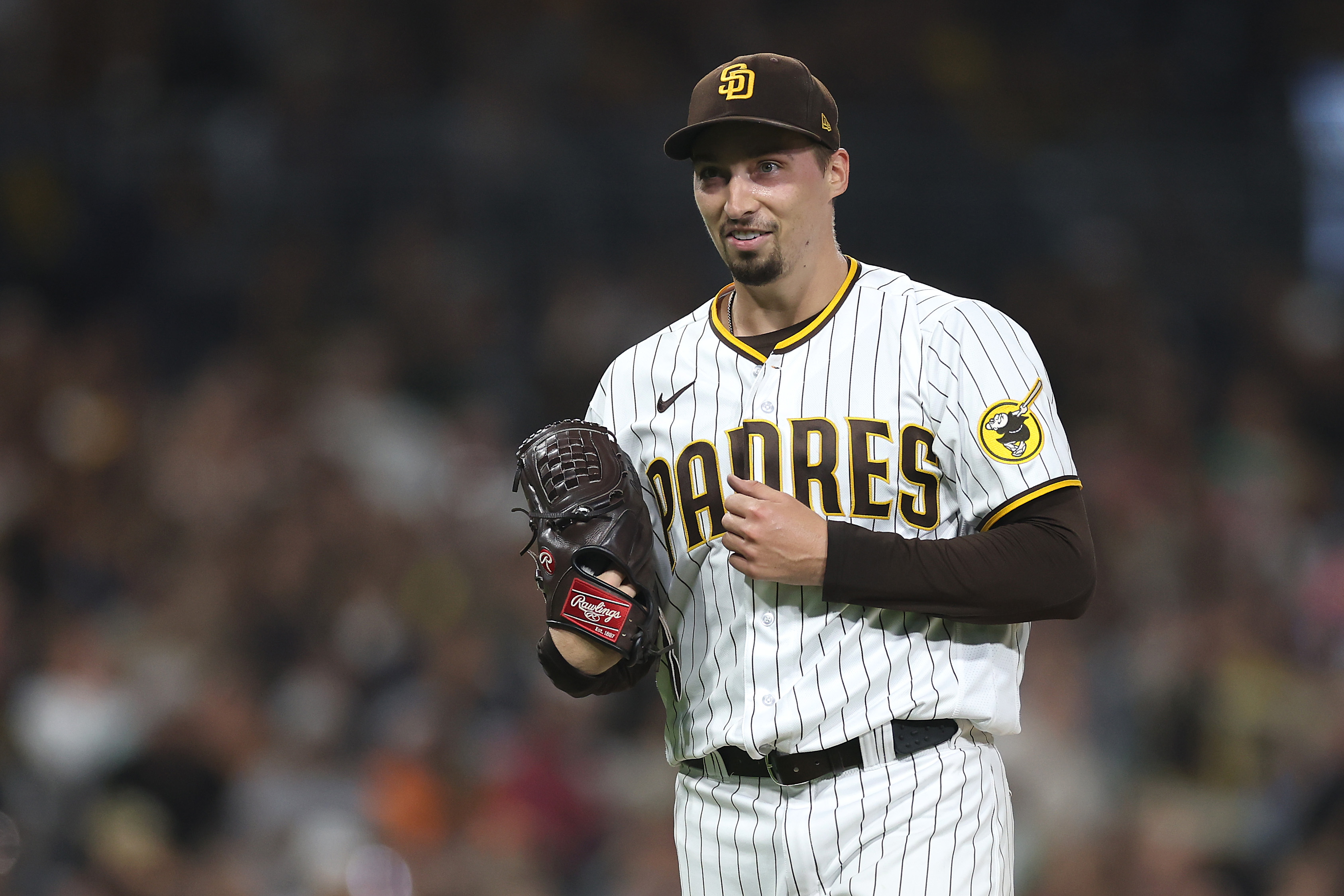 Blake Snell of the San Diego Padres reacts as he walks to the dugout after throwing seven hitless innings a game against the Colorado Rockies at PETCO Park on September 19, 2023 in San Diego, California.