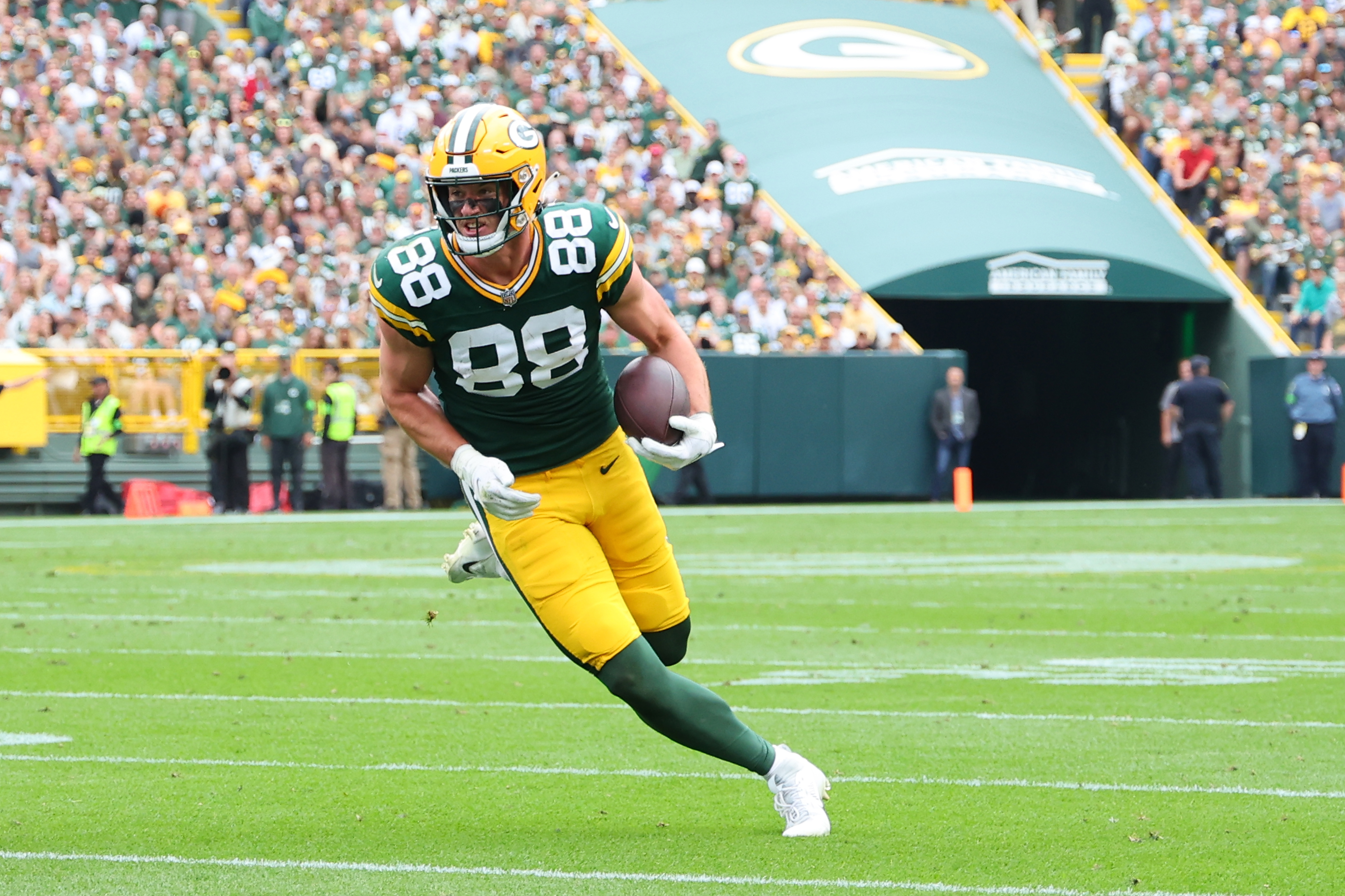 GREEN BAY, WISCONSIN - SEPTEMBER 24: Luke Musgrave #88 of the Green Bay Packers runs for yards after a catch during a game against the New Orleans Saints at Lambeau Field on September 24, 2023 in Green Bay, Wisconsin.