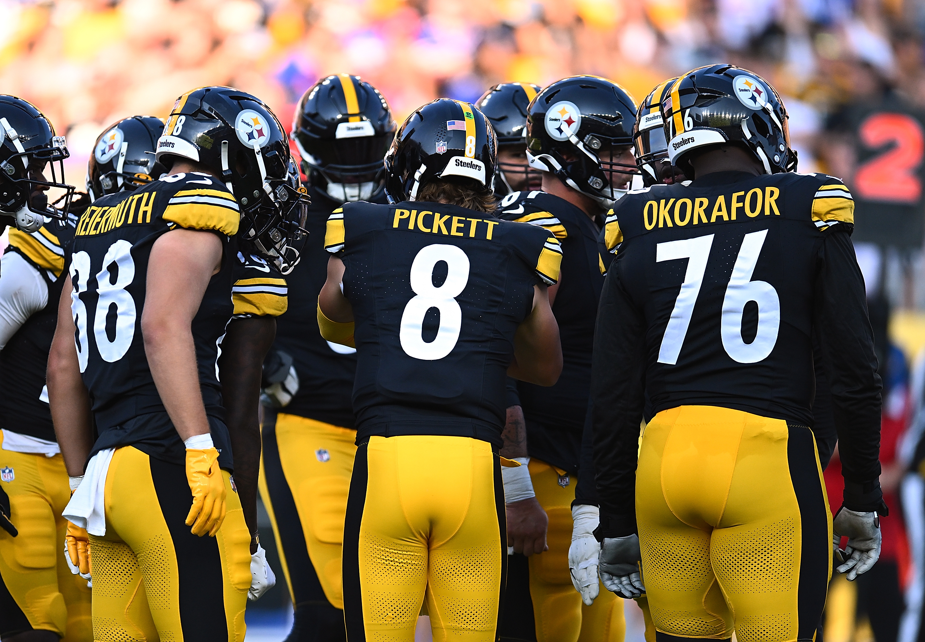 Kenny Pickett #8 of the Pittsburgh Steelers huddles with teammates during the preseason game against the Buffalo Bills at Acrisure Stadium on August 19, 2023 in Pittsburgh, Pennsylvania.
