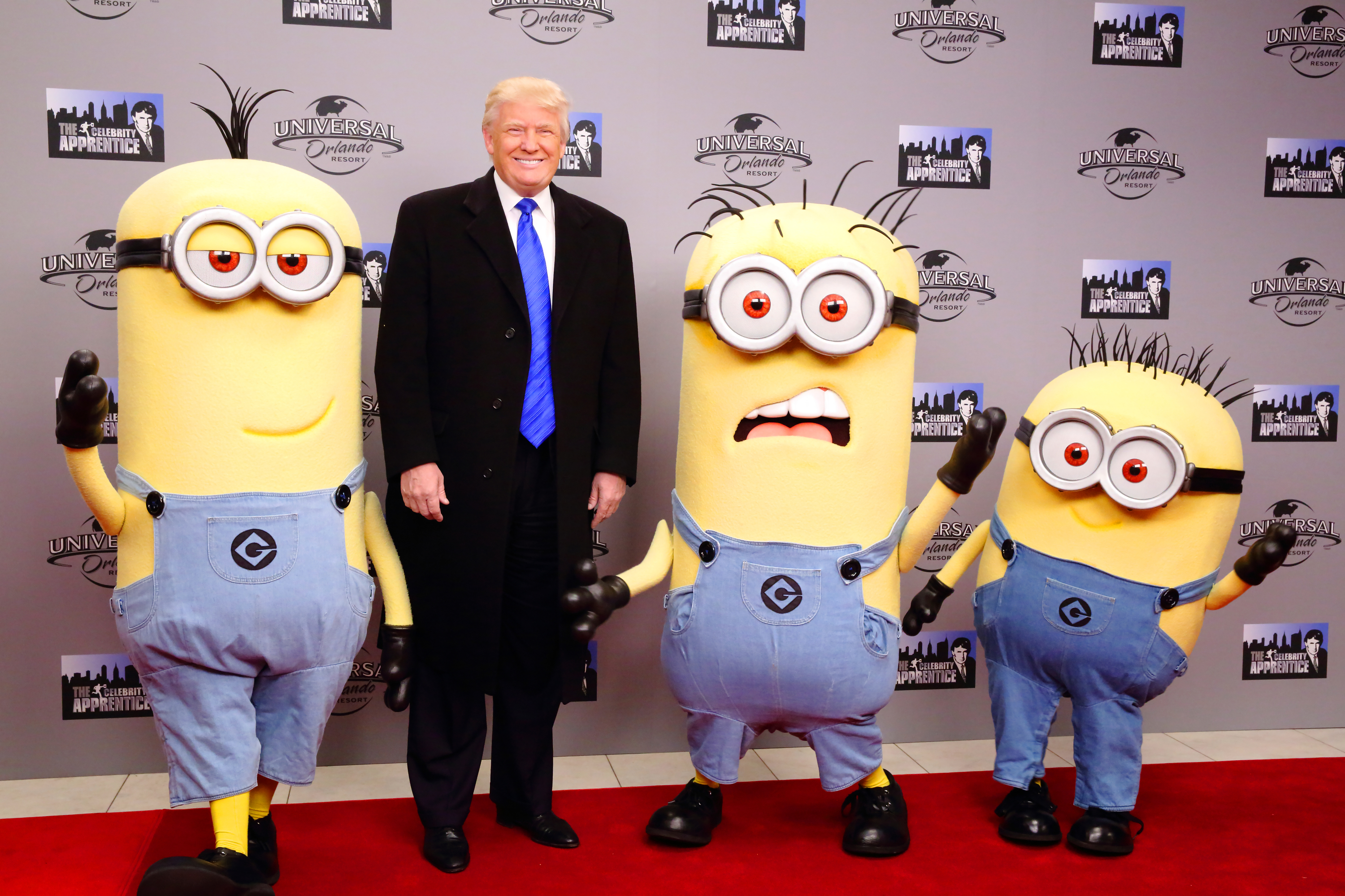 Donald Trump is surrounded by life-size “minions” — yellow humanoid helpers from the Despicable Me movie franchise — in an a symbolic approximation of his primary opposition.