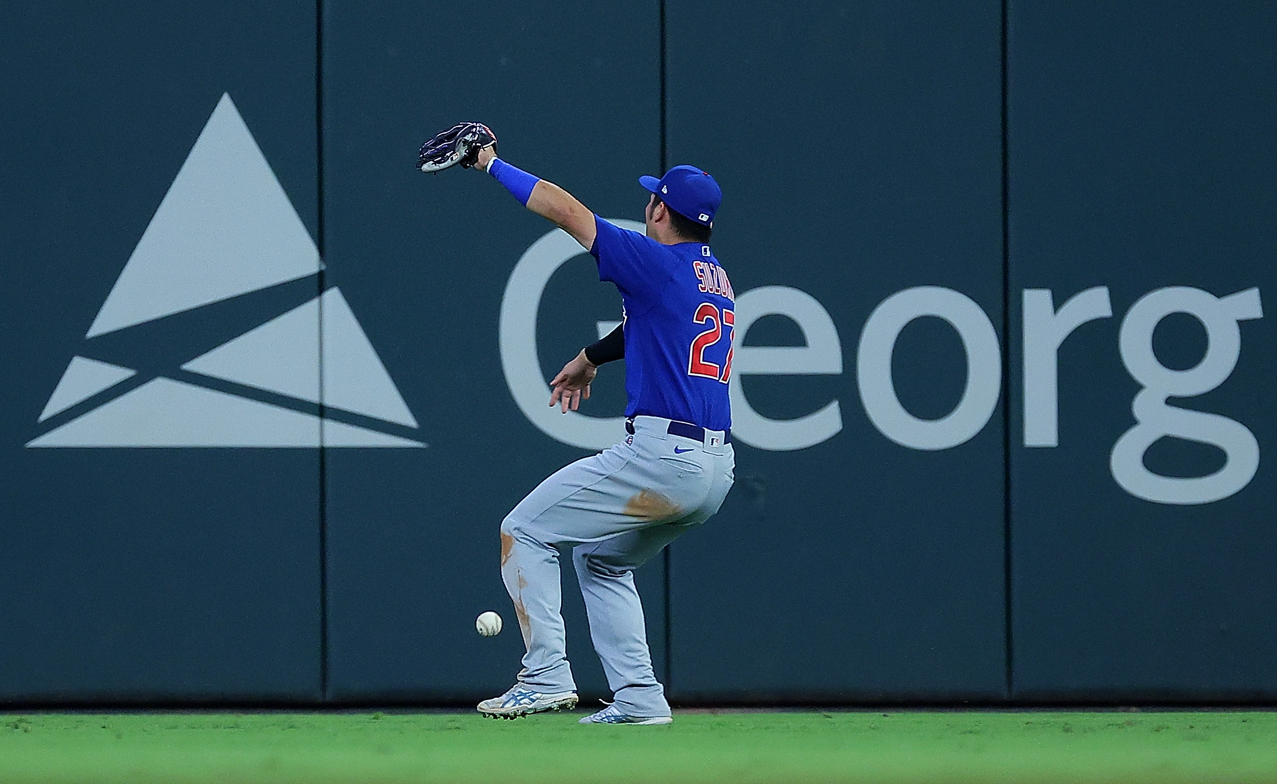 Seiya Suzuki of the Chicago Cubs makes a fielding error as he fails to catch this fly ball by Sean Murphy of the Atlanta Braves in the eighth inning at Truist Park on September 26, 2023 in Atlanta, Georgia.
