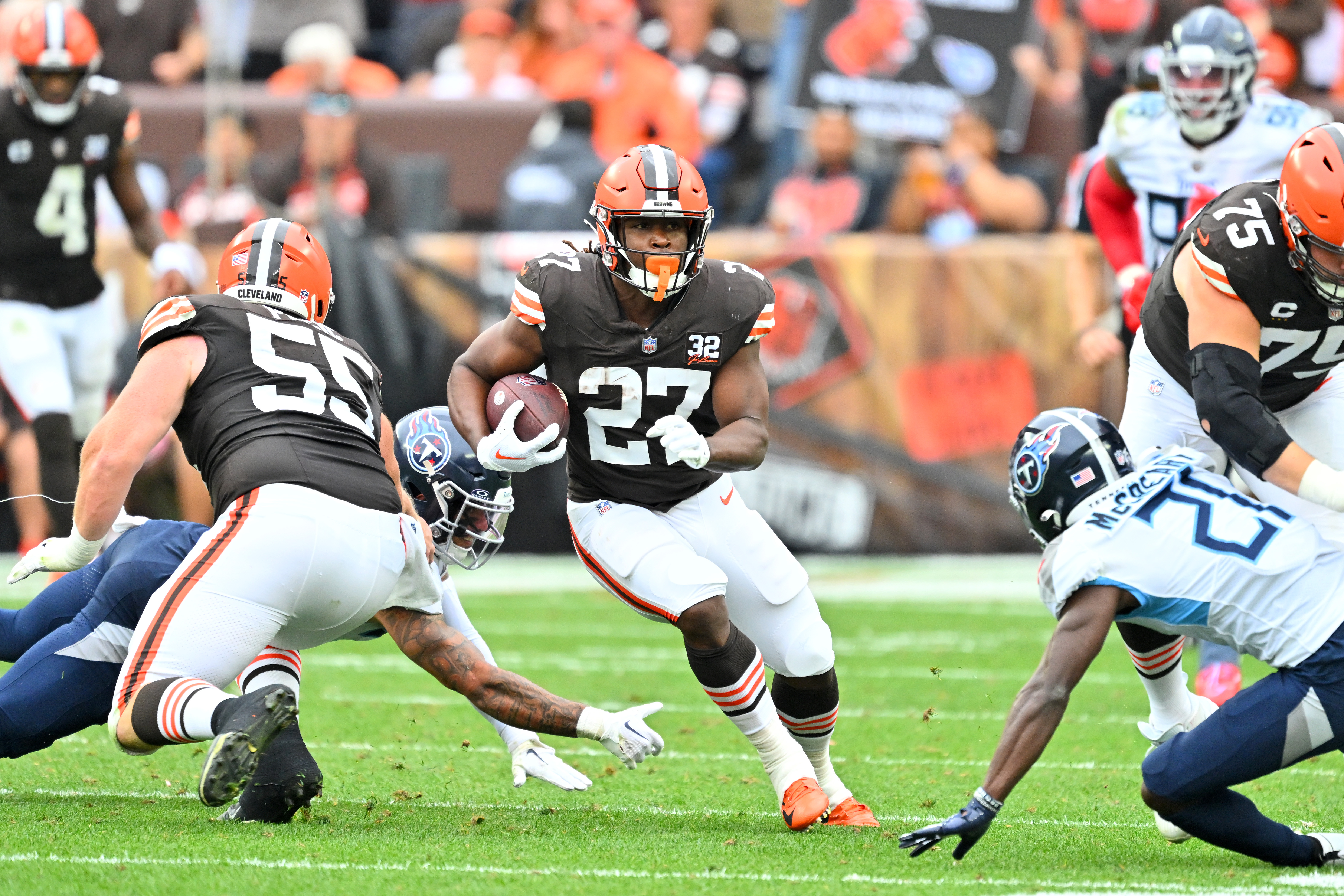 Running back Kareem Hunt #27 of the Cleveland Browns runs for a gain during the third quarter against the Tennessee Titans at Cleveland Browns Stadium on September 24, 2023 in Cleveland, Ohio. The Browns defeated the Titans 27-3.
