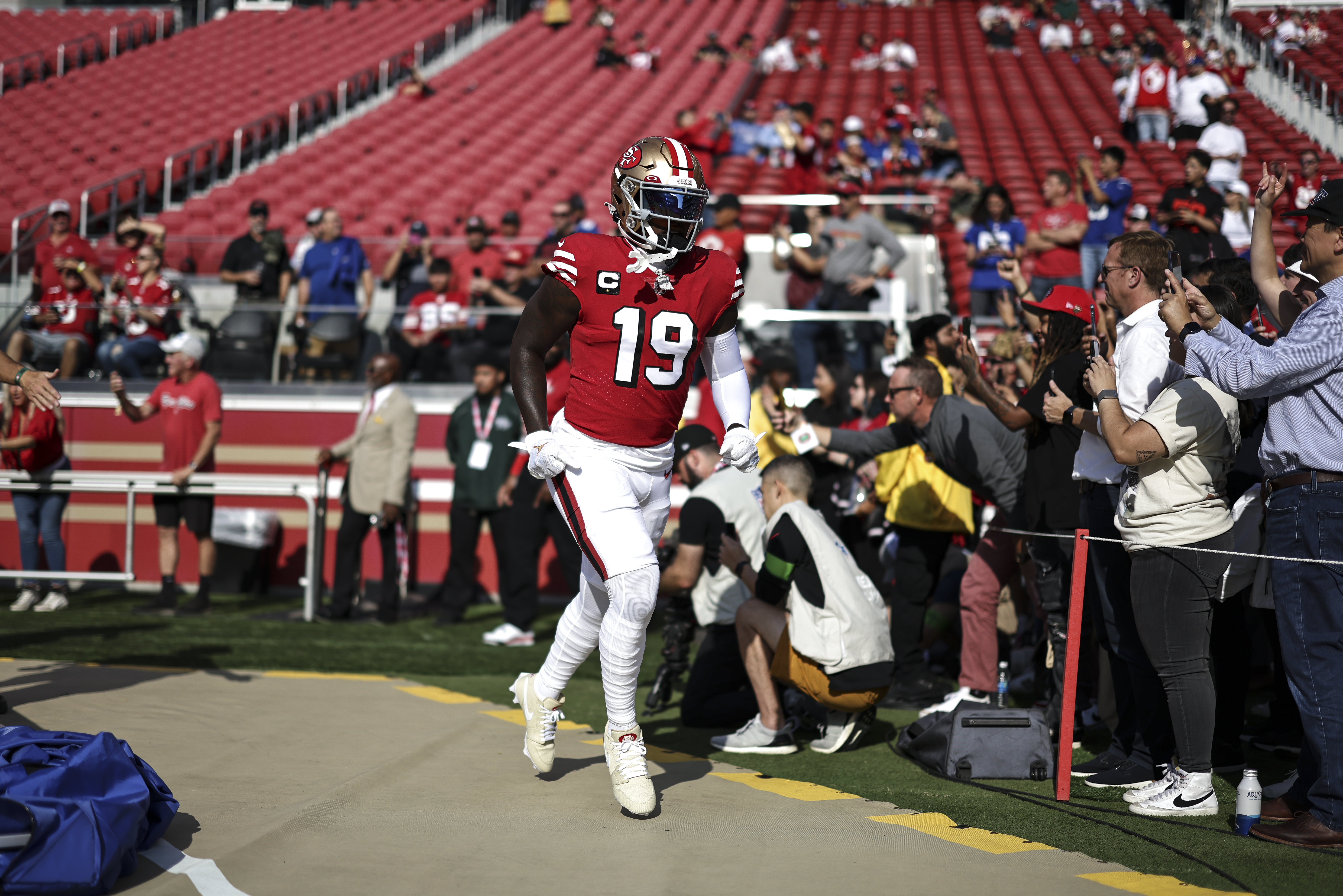 Deebo Samuel #19 of the San Francisco 49ers runs as he takes the field prior to an NFL football game between the San Francisco 49ers and the New York Giants at Levi’s Stadium on September 21, 2023 in Santa Clara, California.